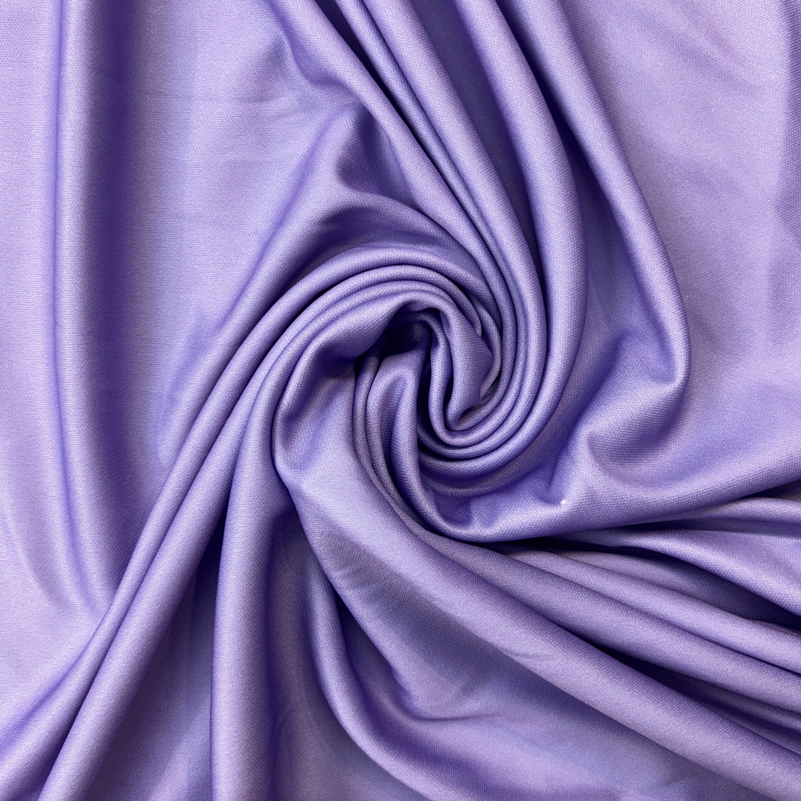 Close-up of purple fabric with folds