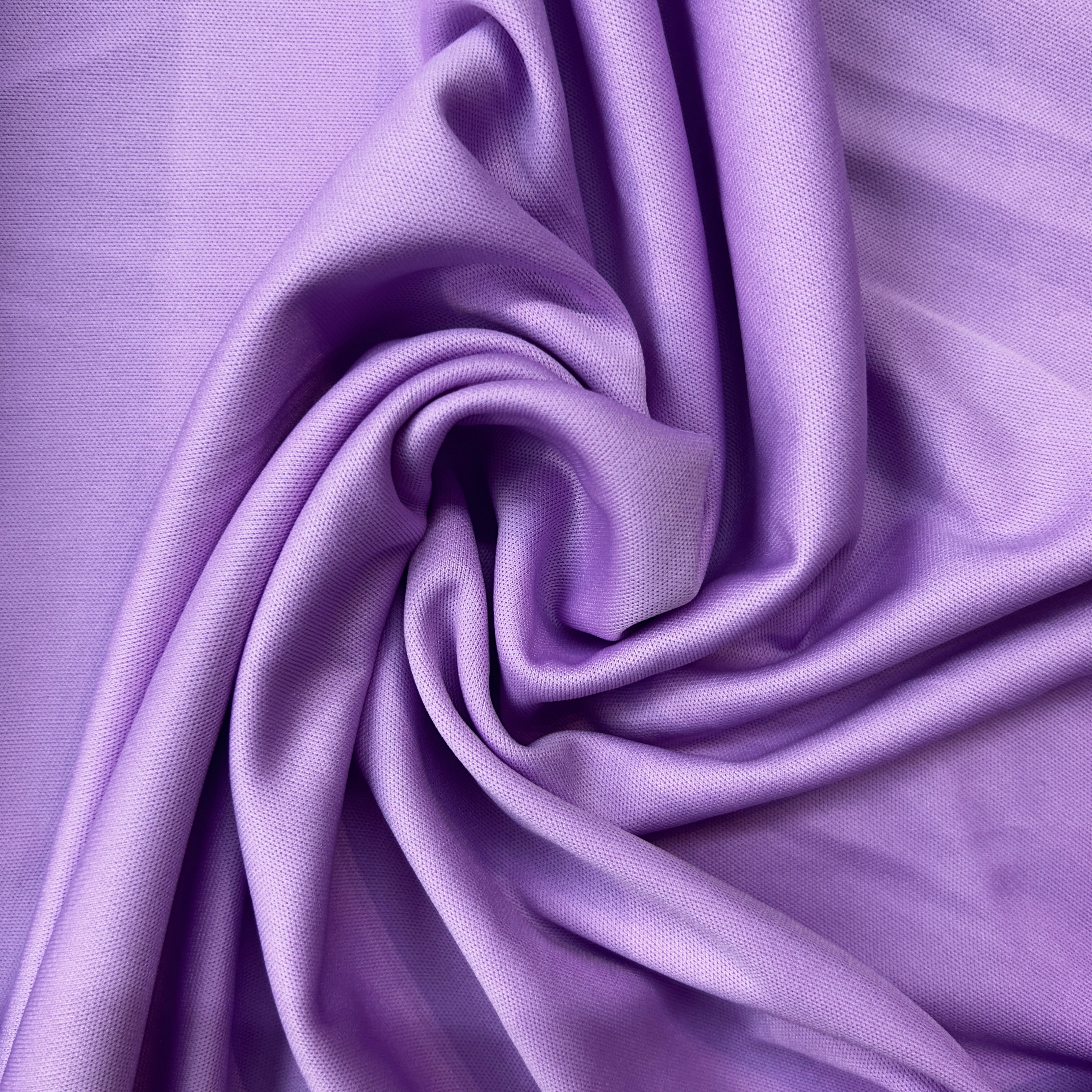 Close-up of purple fabric with folds