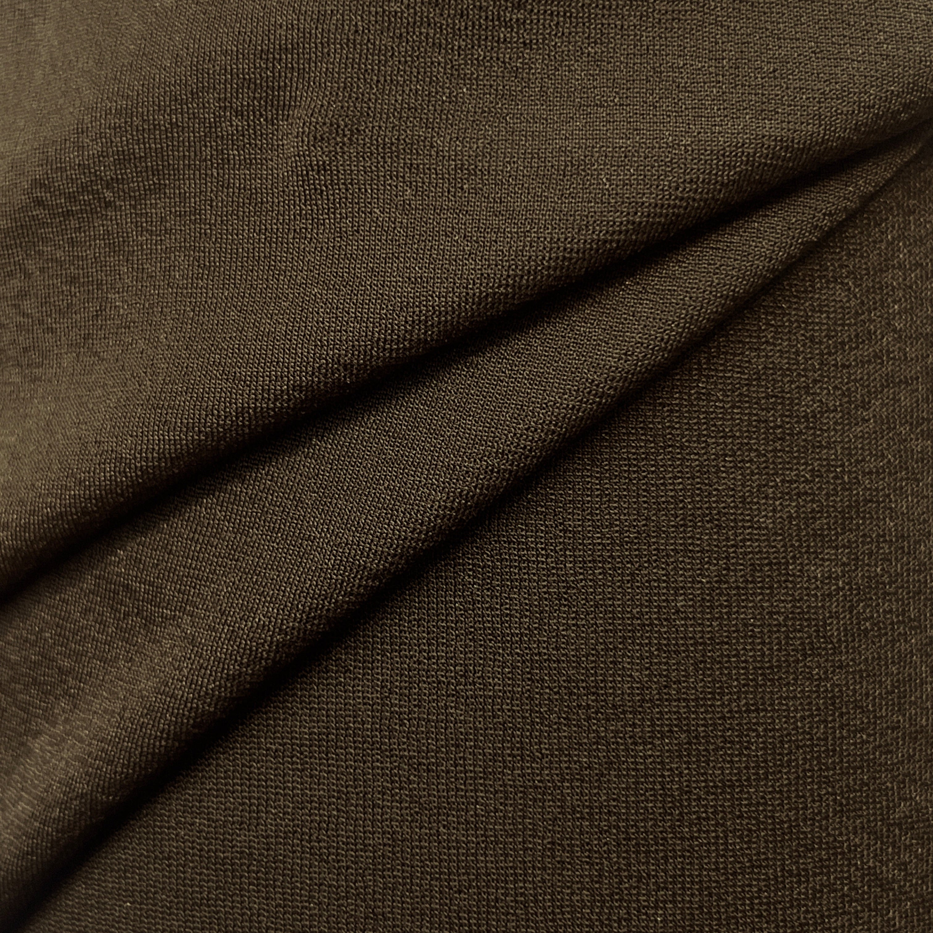 Close-up of brown fabric with a subtle texture