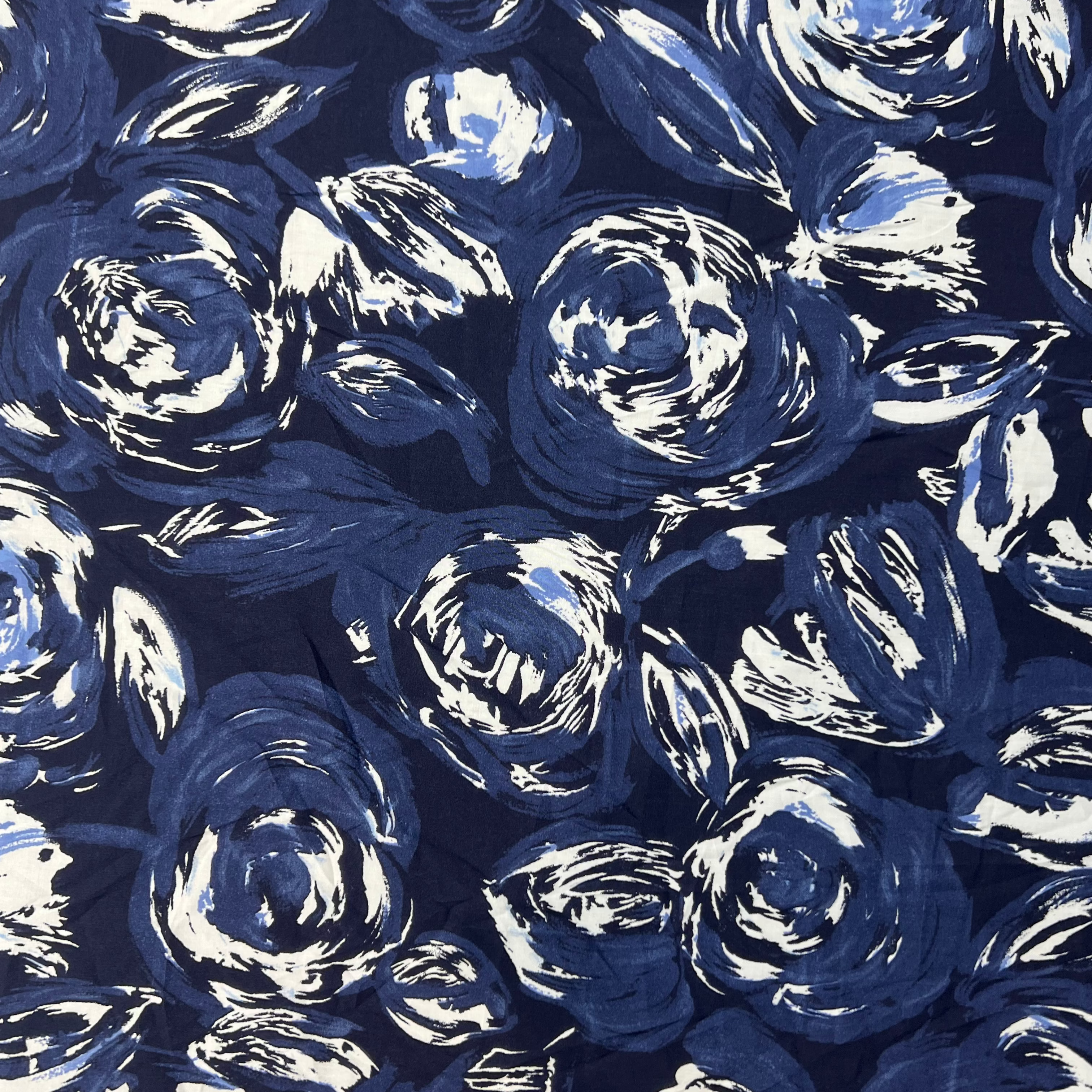 Pattern of blue roses on a blue background