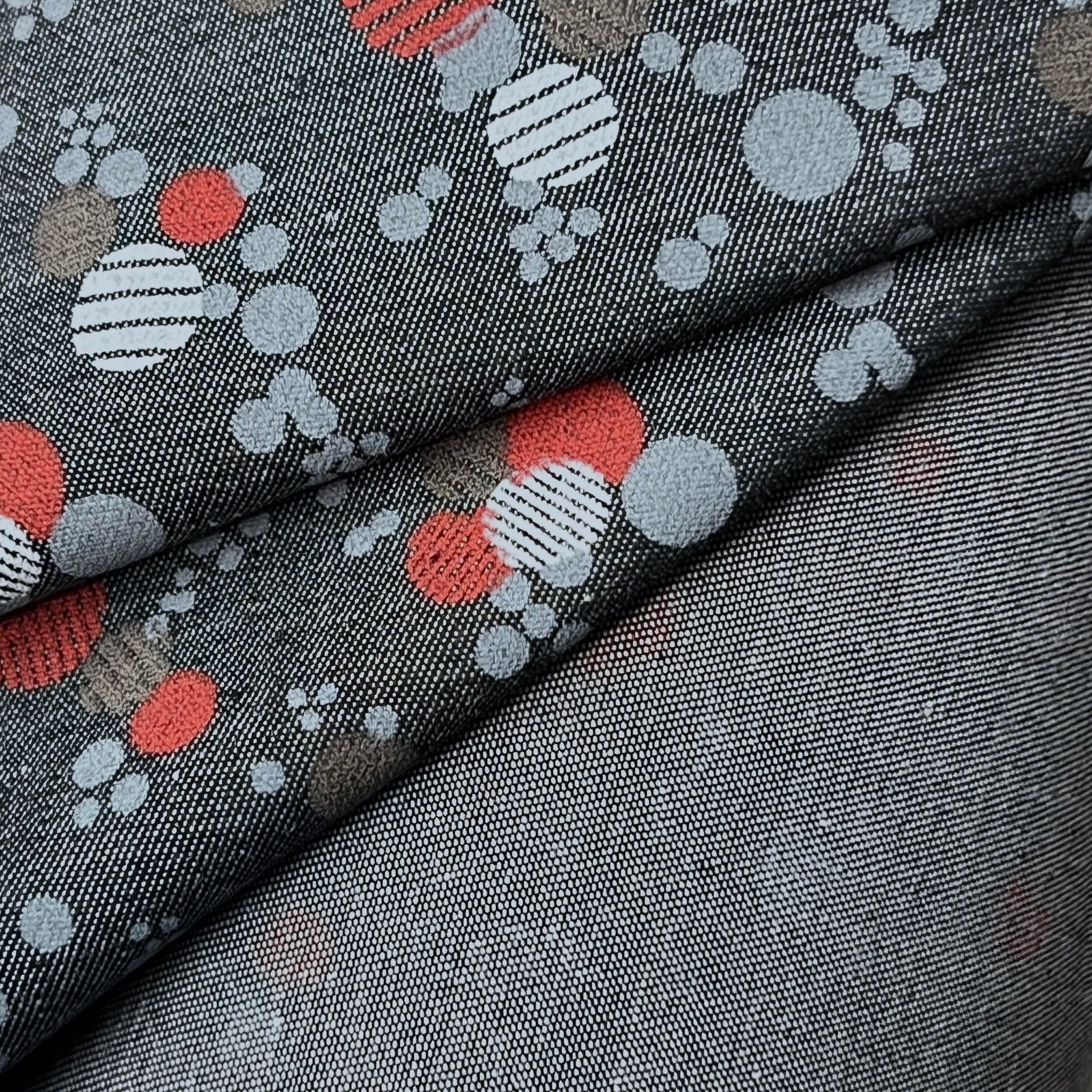 Gray fabric with colorful dot pattern