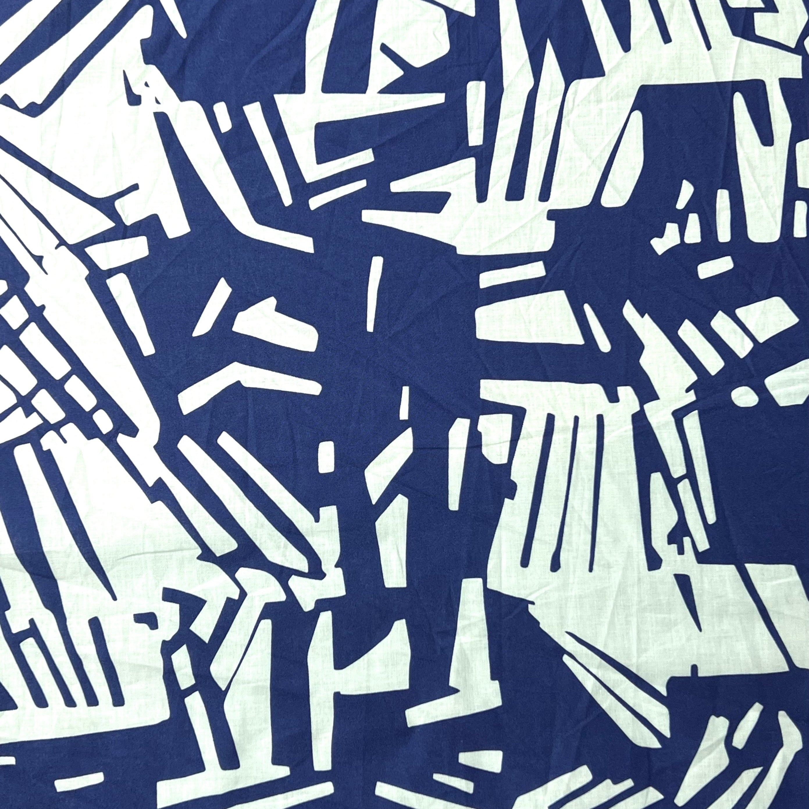 Blue and white abstract pattern on a fabric background