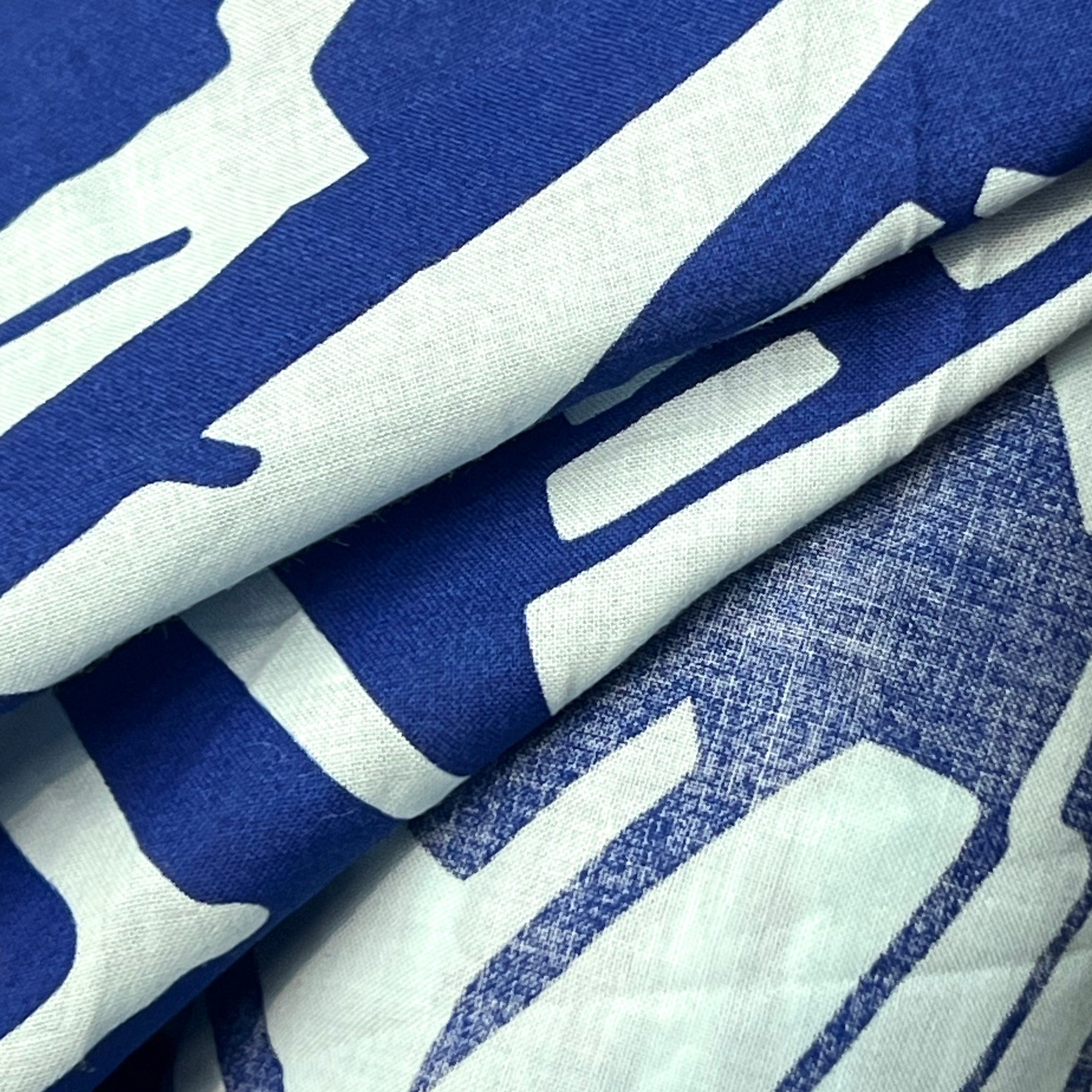 Close-up of blue and white fabric with a pattern