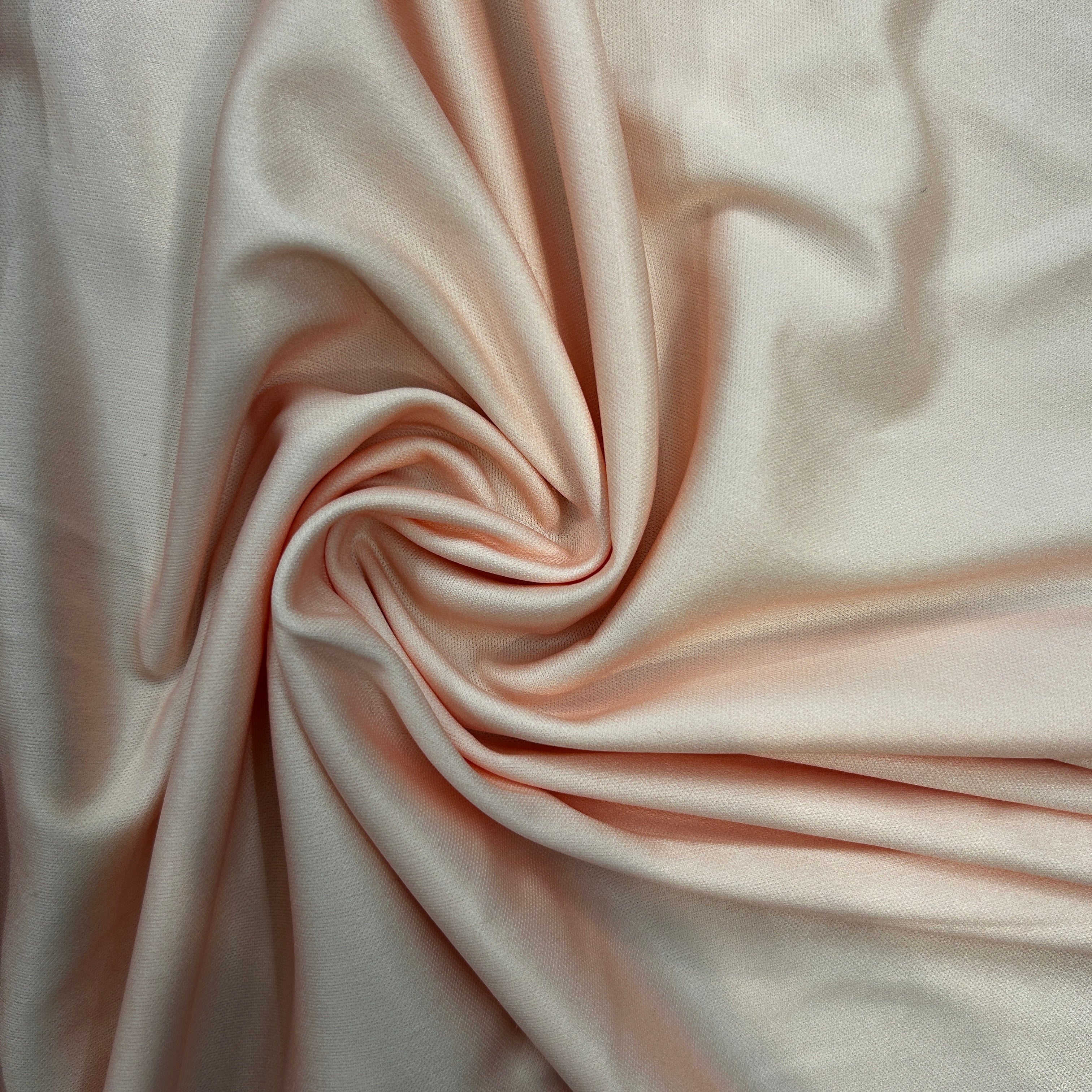 Close-up of pink fabric with folds