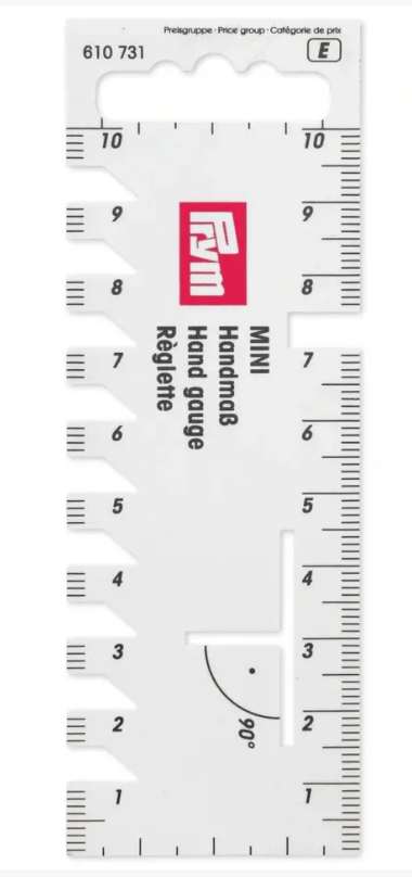 White plastic hand gauge with centimeter scale and 90 degree angle marking.