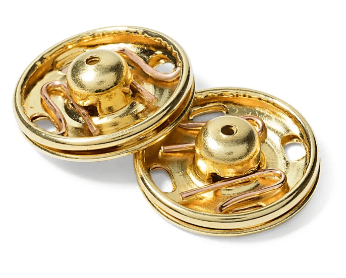 Gold-colored brass sew-on snap fasteners with a folded-back stud.