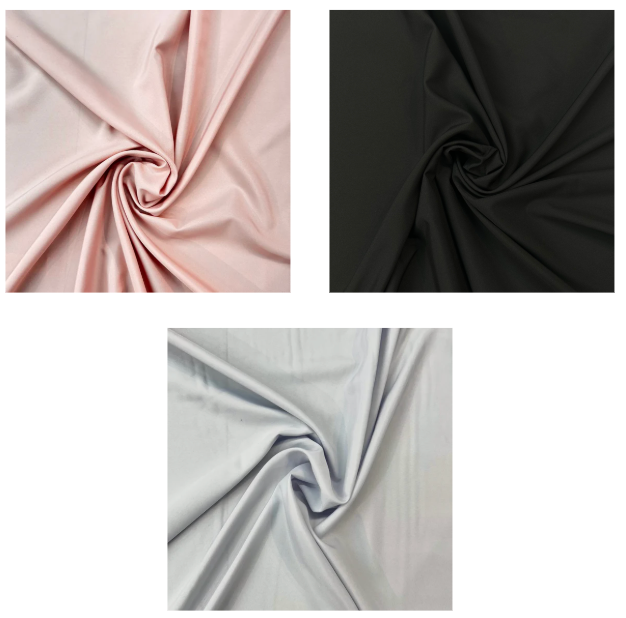 Three swatches of polyester dressmaking fabric in bubblegum pink, black, and light grey.
