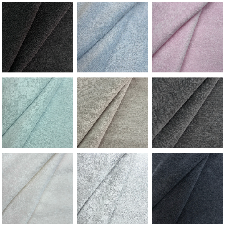 Grid of stretch terry toweling fabric swatches in nine colors including black, blue, pink, and grey.