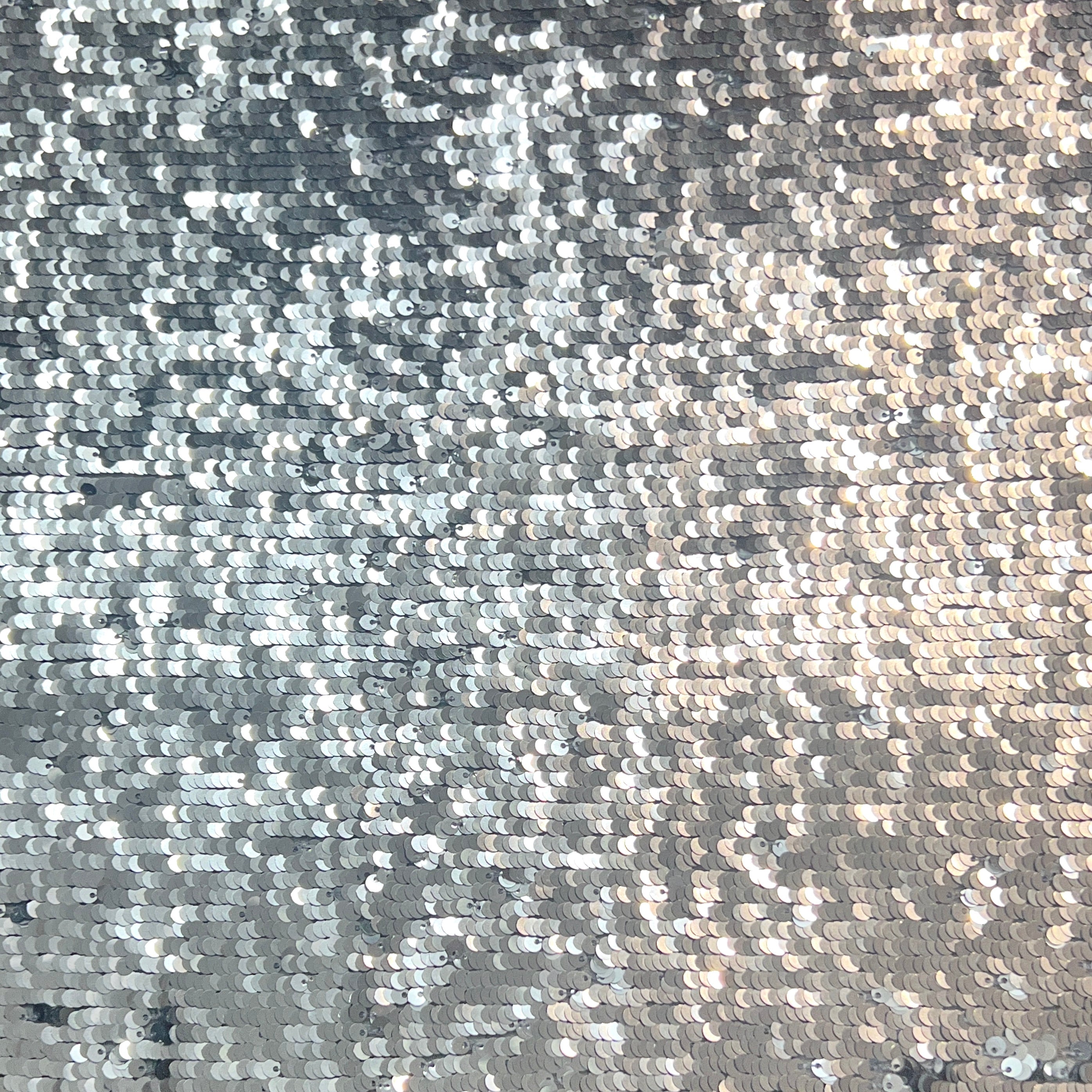 Close-up of a textured surface with a pattern of small stones or pebbles.