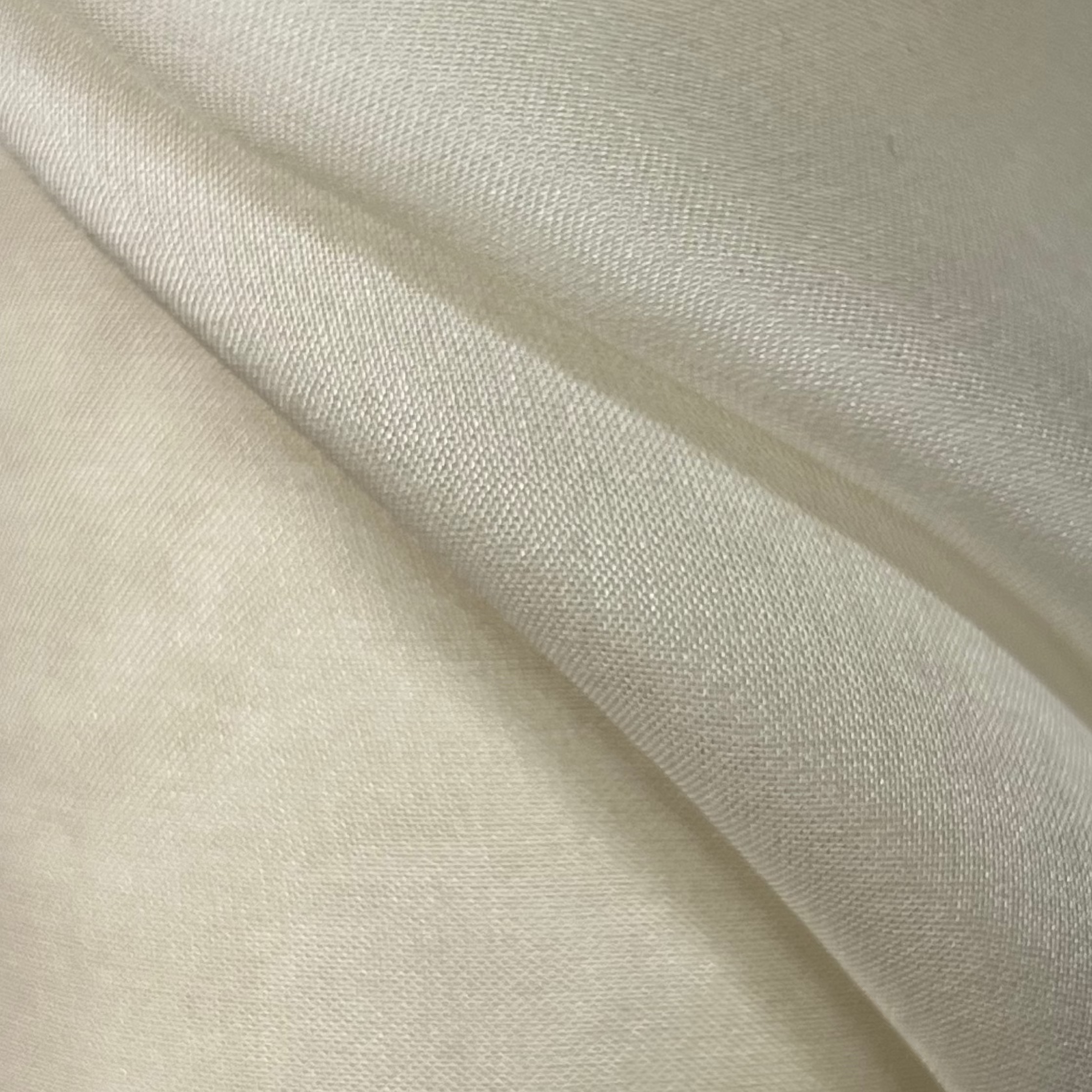 Close-up of beige fabric with a subtle texture