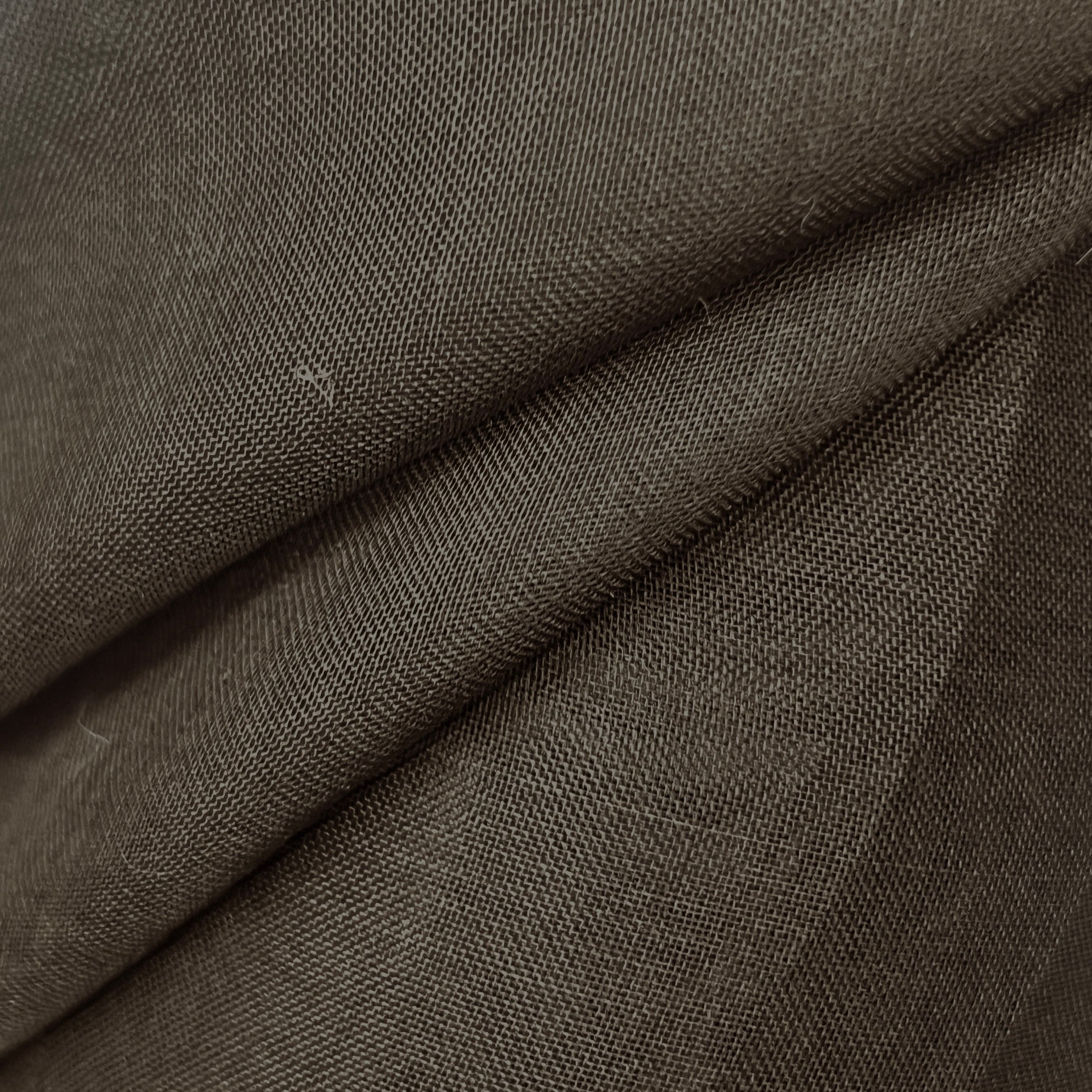 Close-up of brown fabric with a textured pattern
