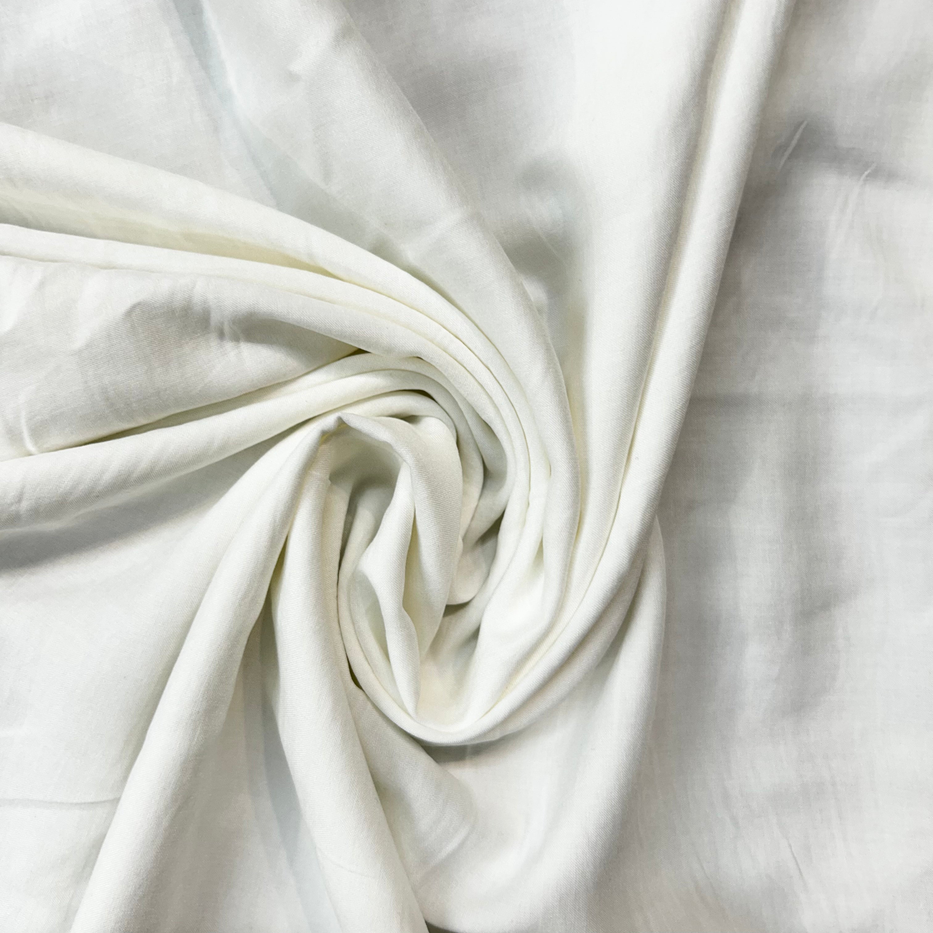 Close-up of white fabric with folds