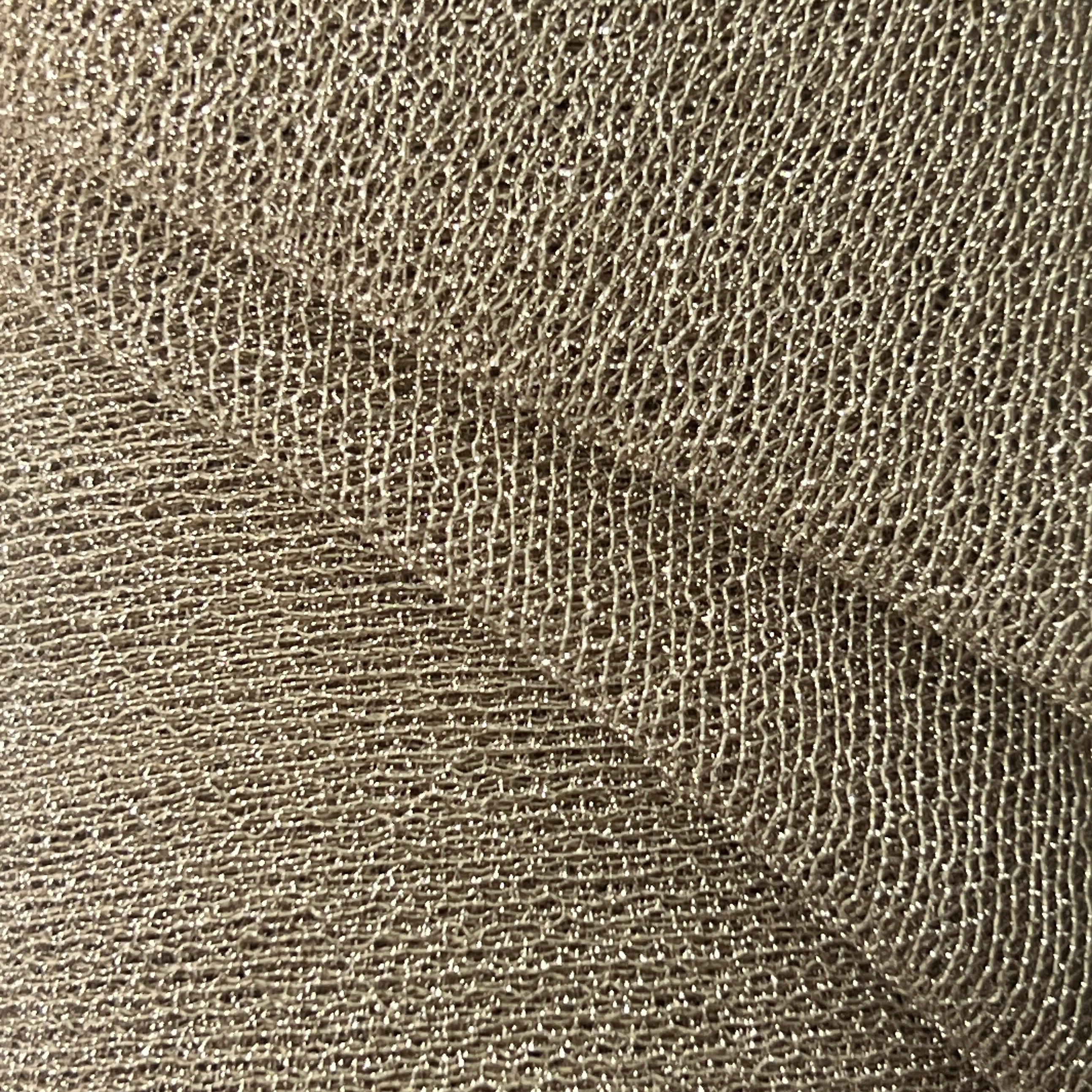 Close-up of a textured brown fabric surface