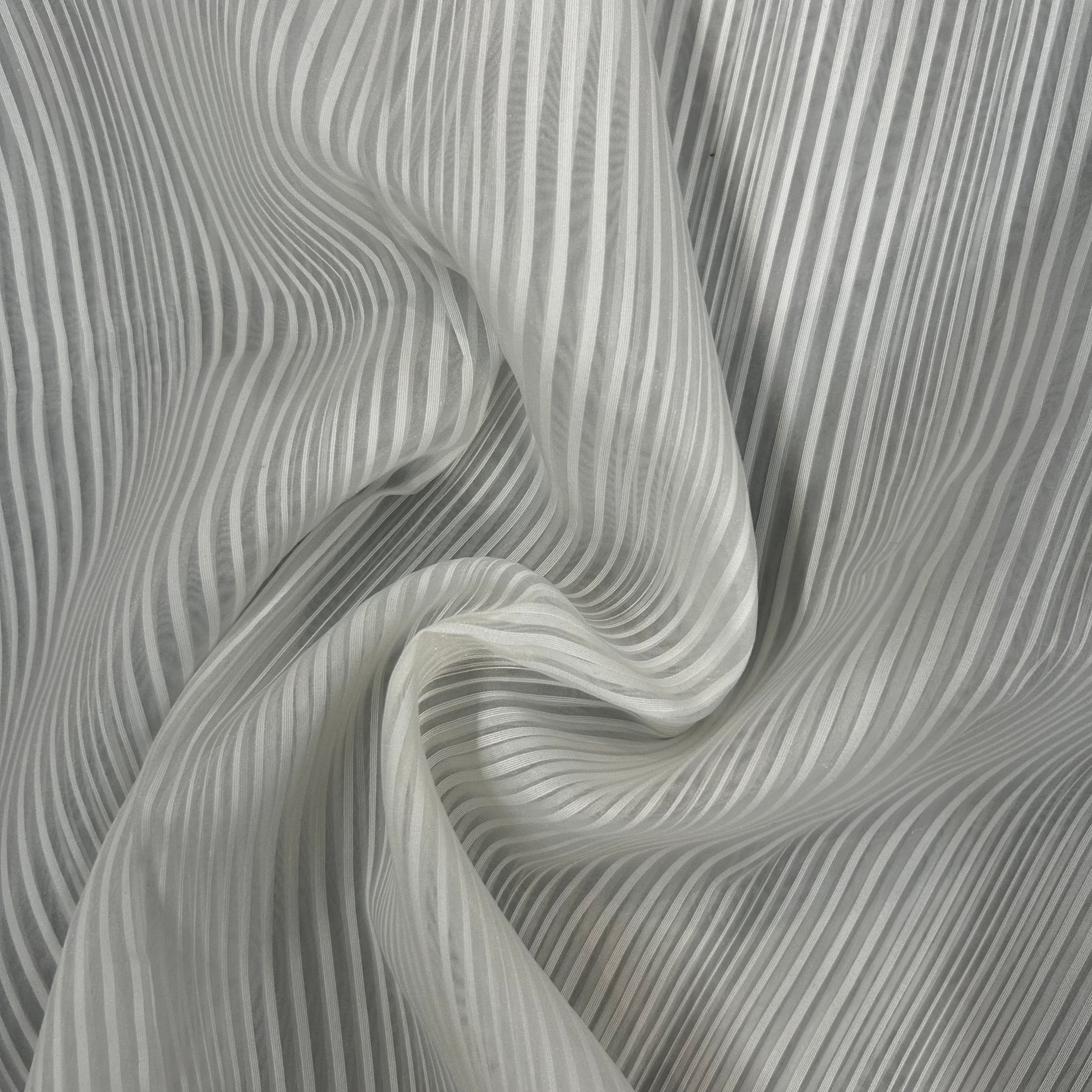 Wavy pattern of gray lines on a textured surface