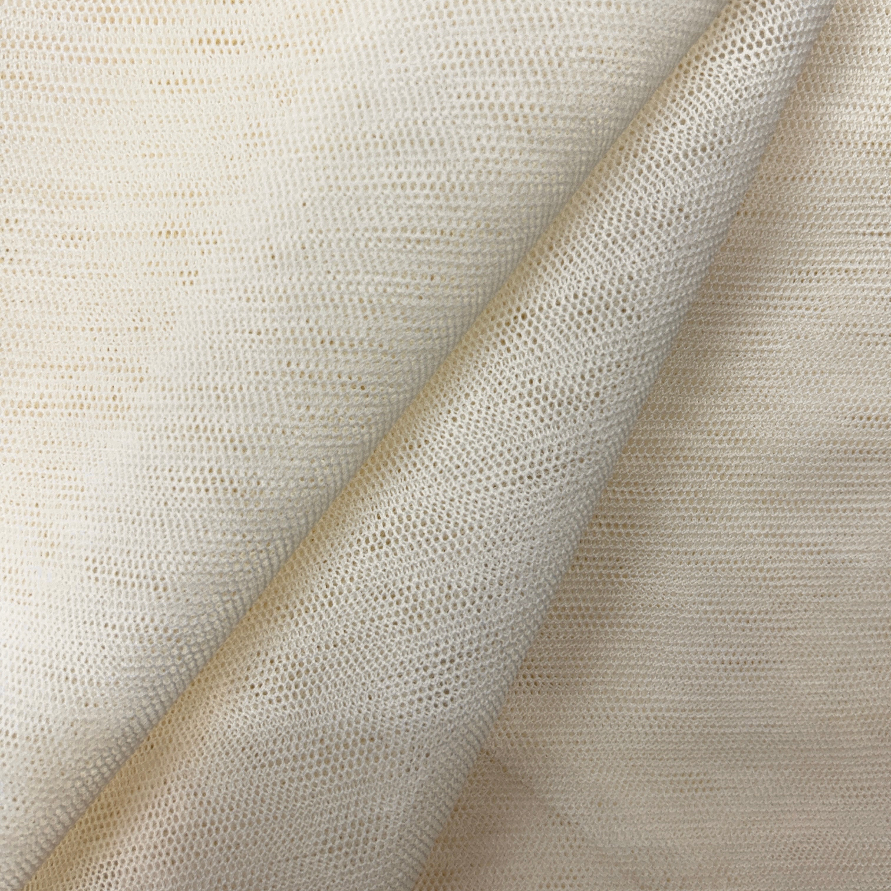 Close-up of beige fabric with a textured pattern