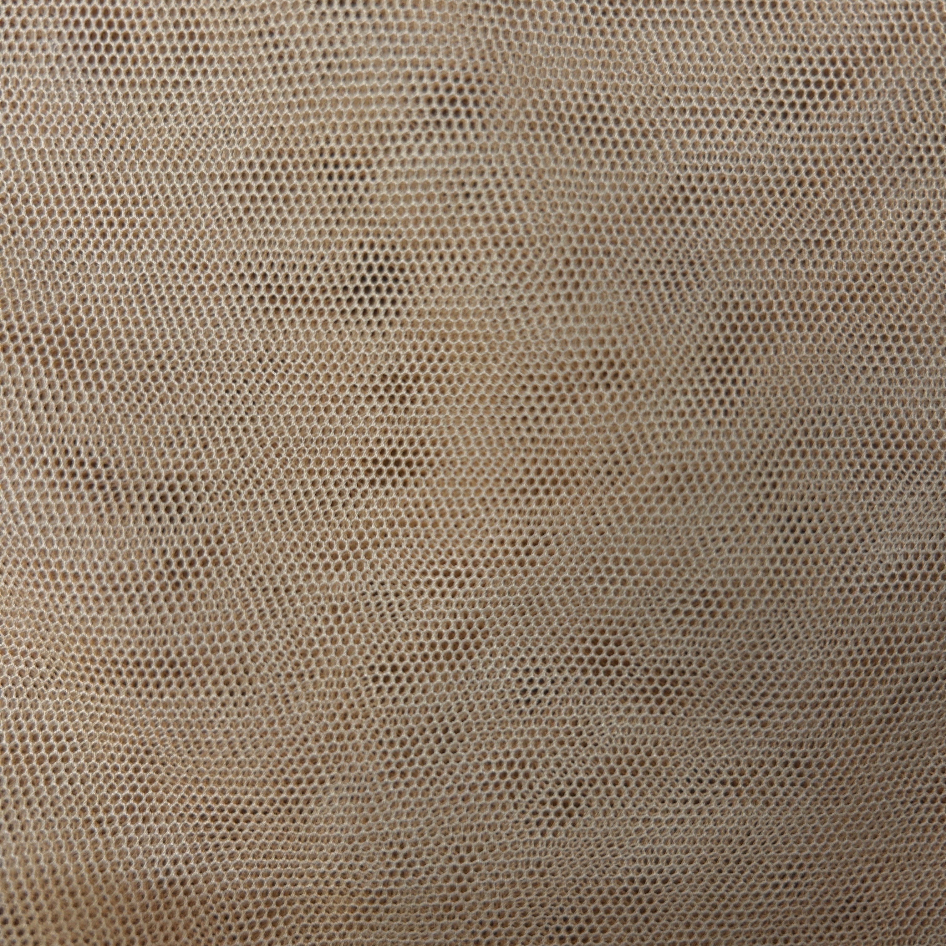 Close-up of a textured beige fabric with a subtle pattern