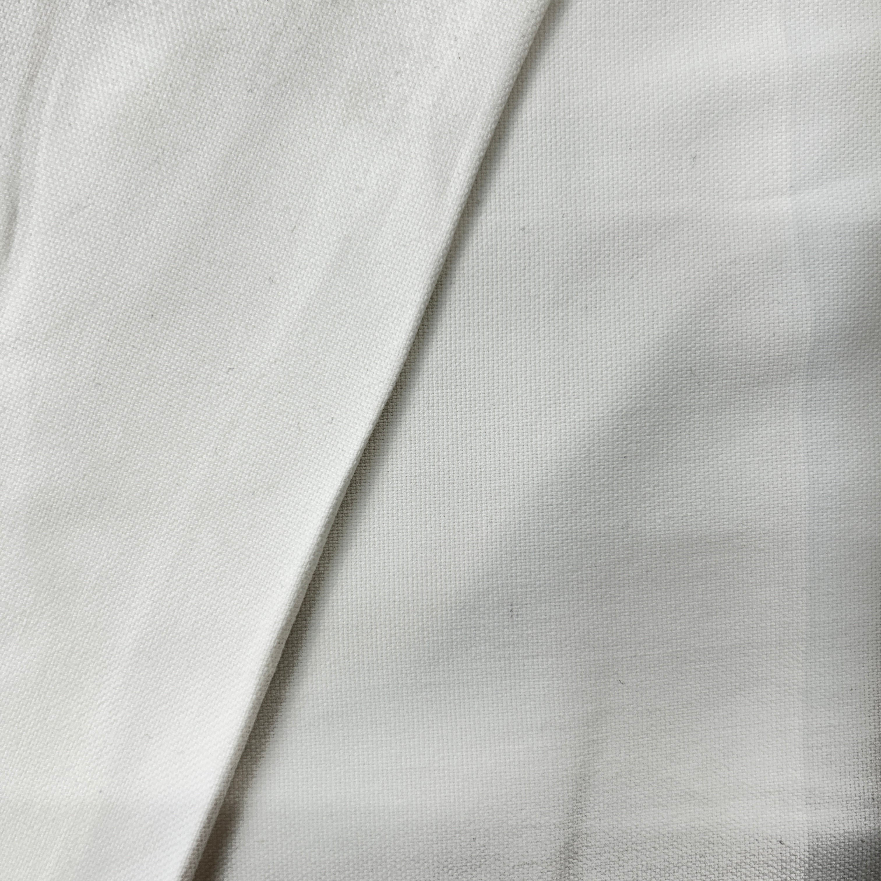 Close-up of white fabric with a subtle texture