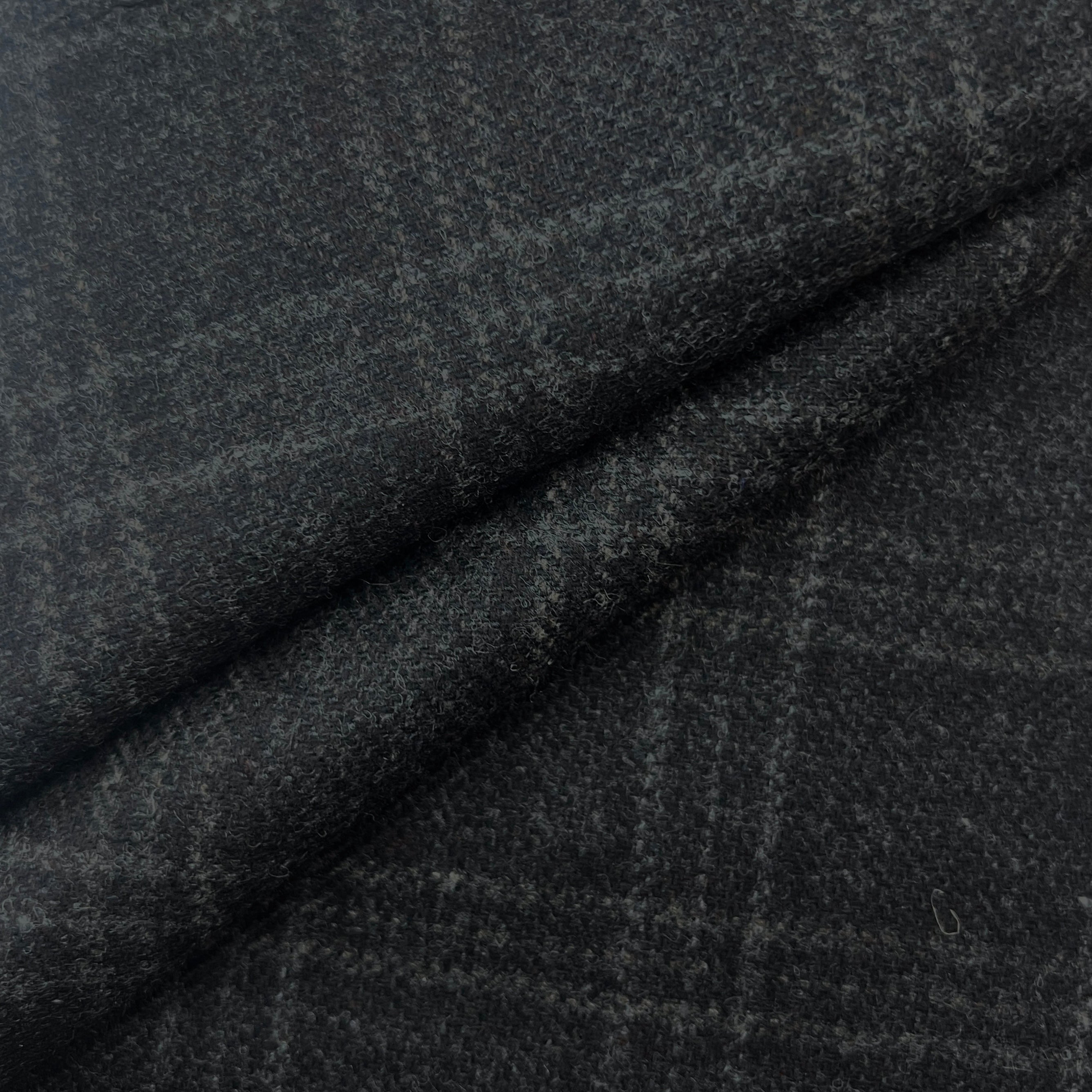 Dark gray fabric with a subtle pattern