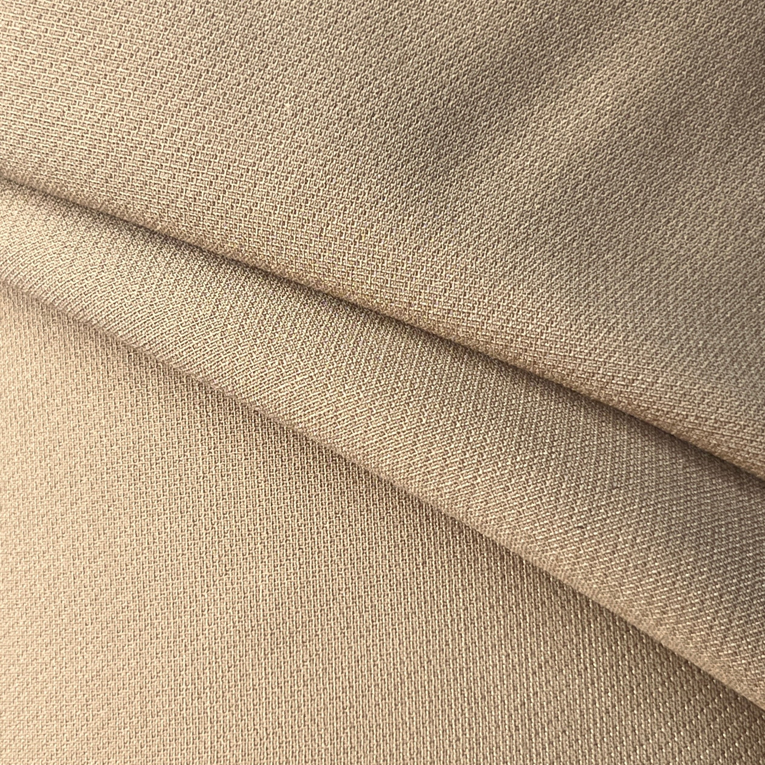 Close-up of beige fabric with a slight texture