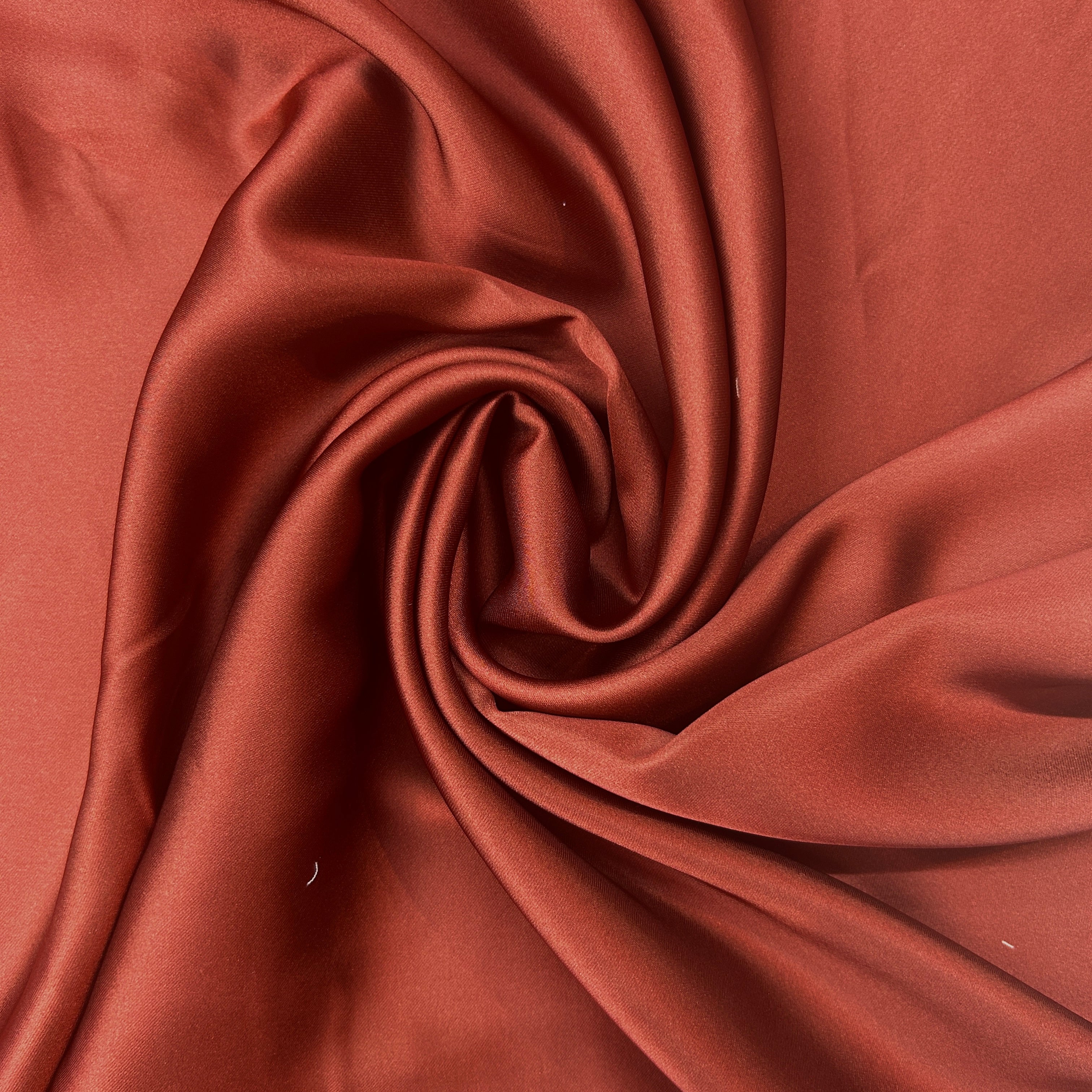 Close-up of brown fabric with a swirl pattern