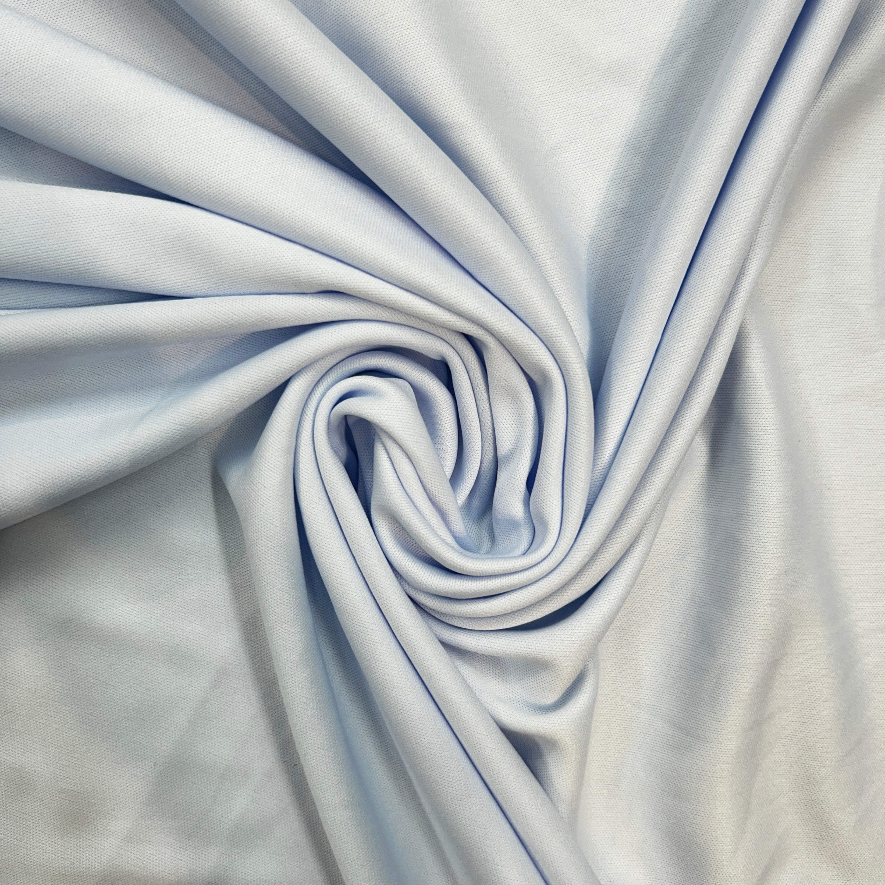 Close-up of light blue fabric with folds