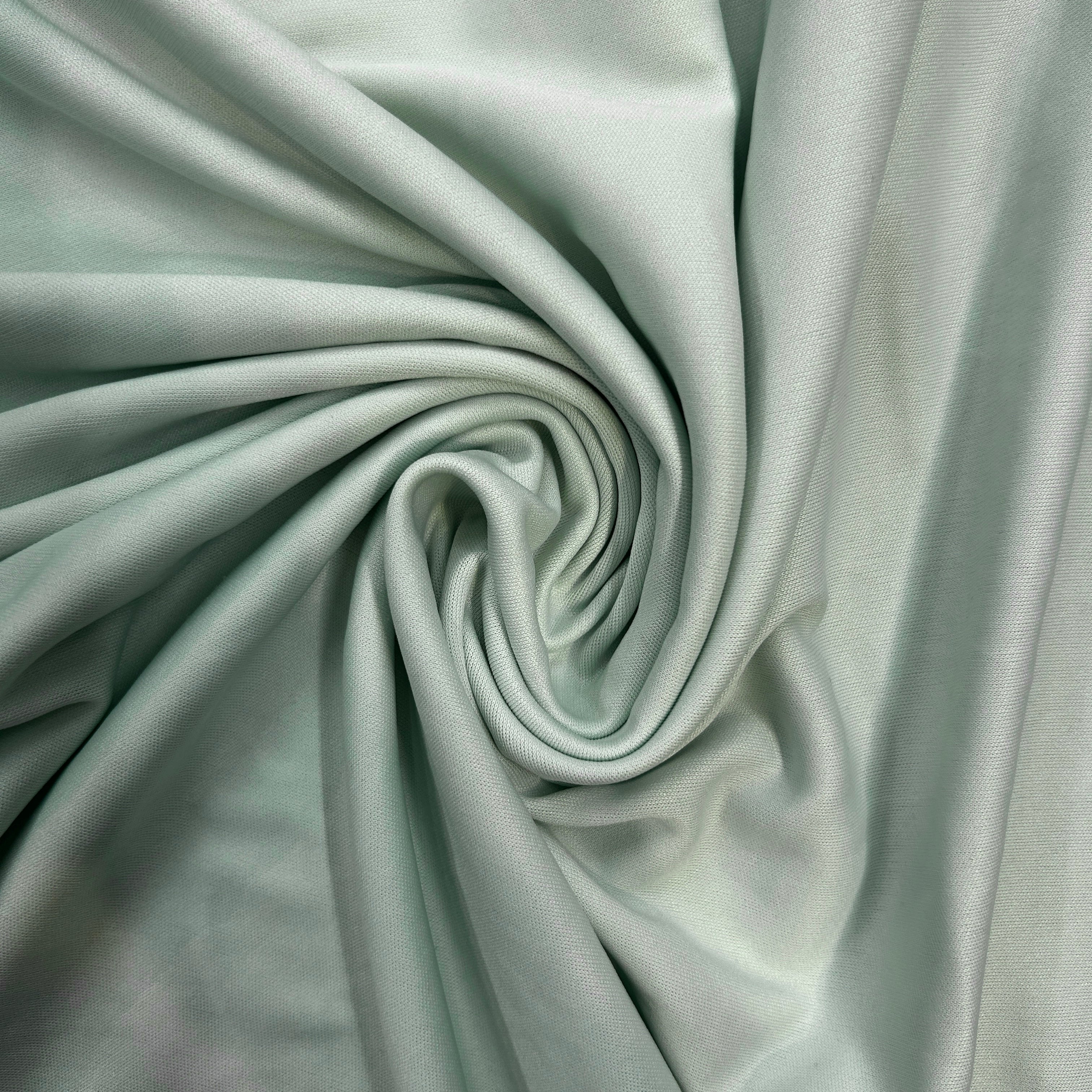 Close-up of light gray fabric with a swirl pattern