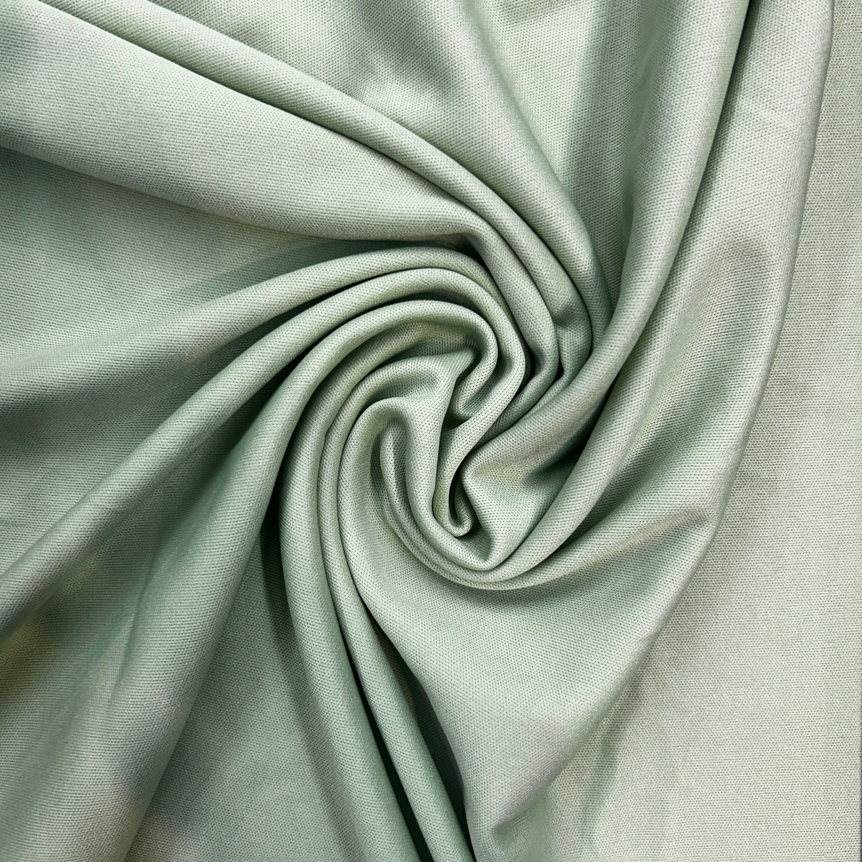 Close-up of light gray fabric with folds