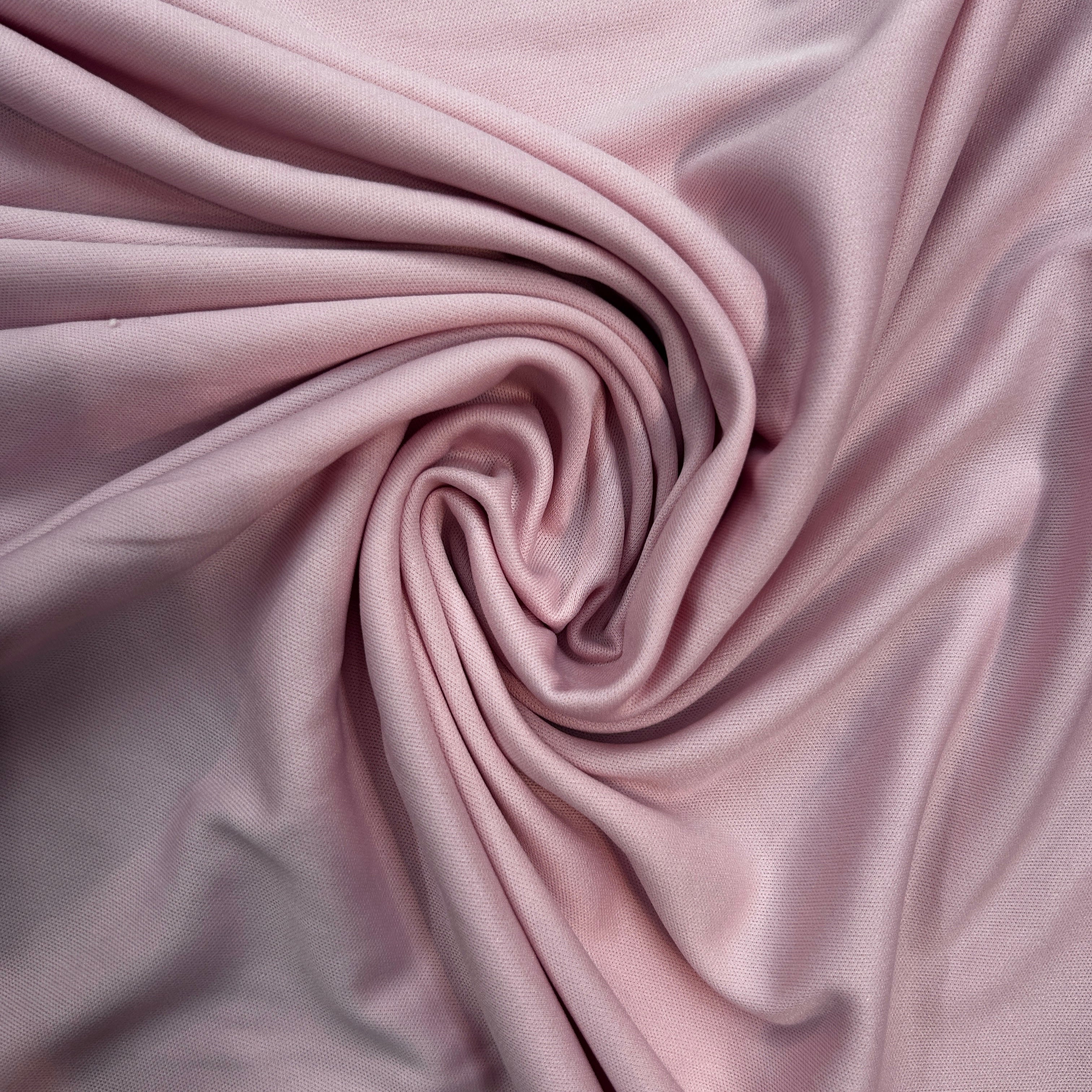 Close-up of pink fabric with folds