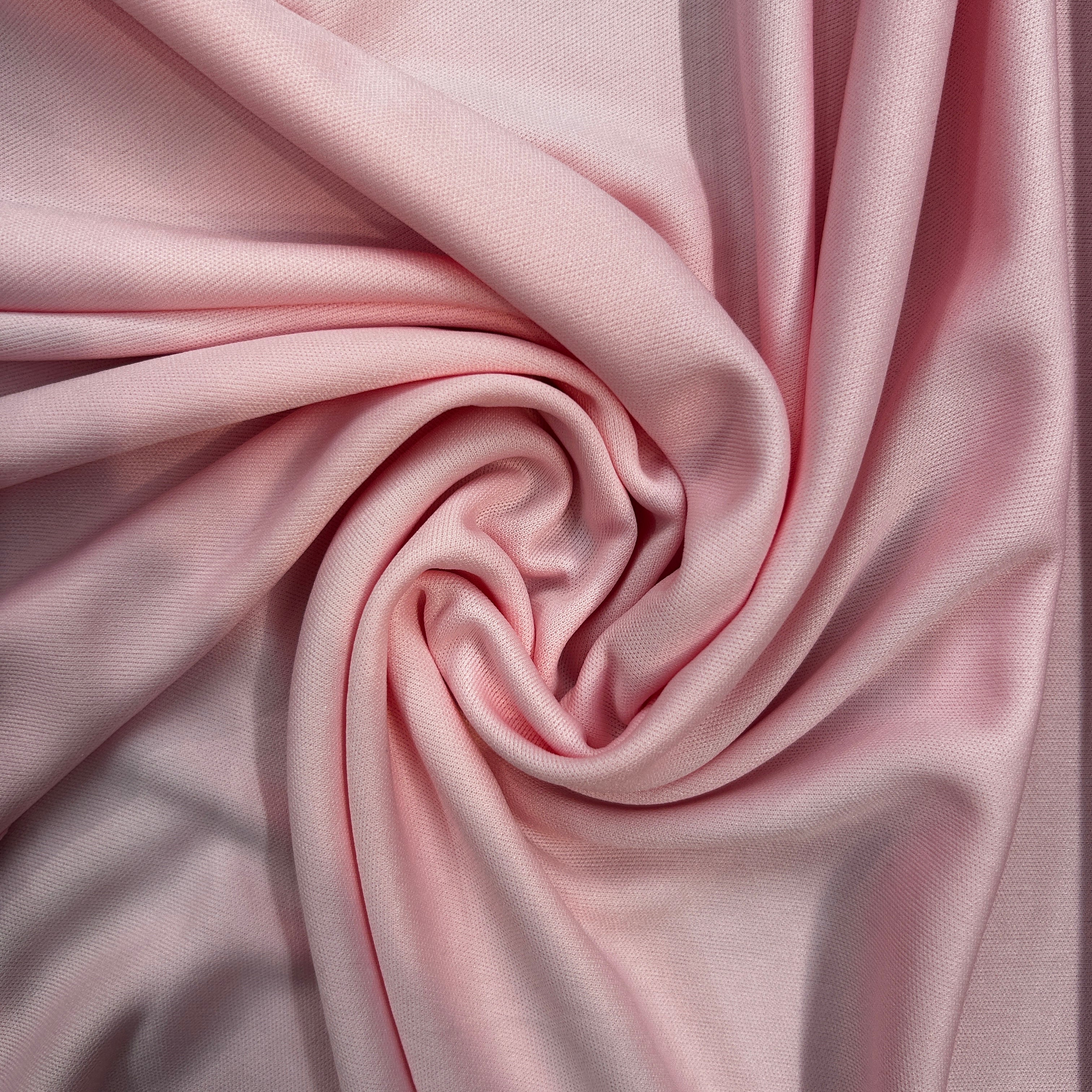 Close-up of pink fabric with folds