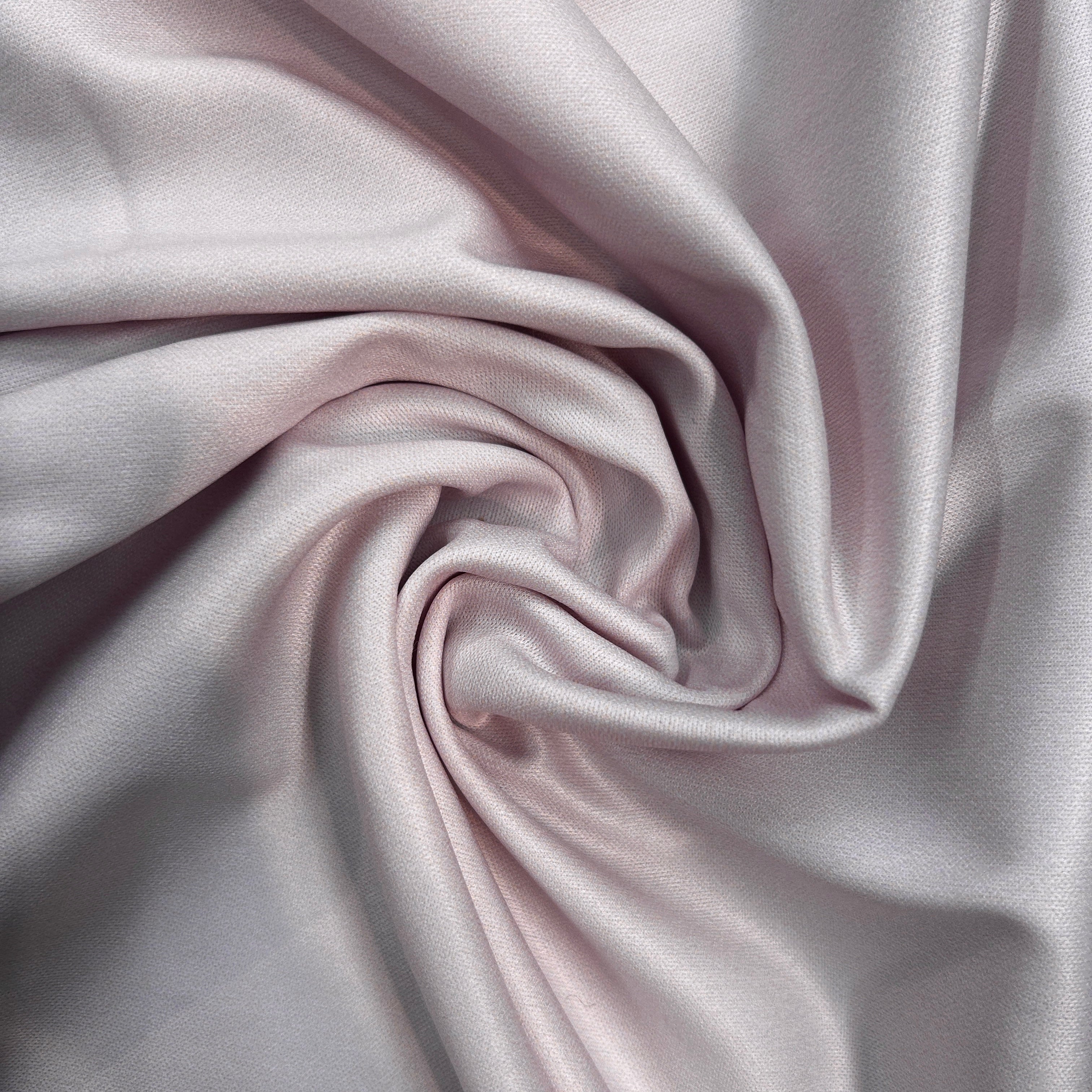 Close-up of pink fabric with folds