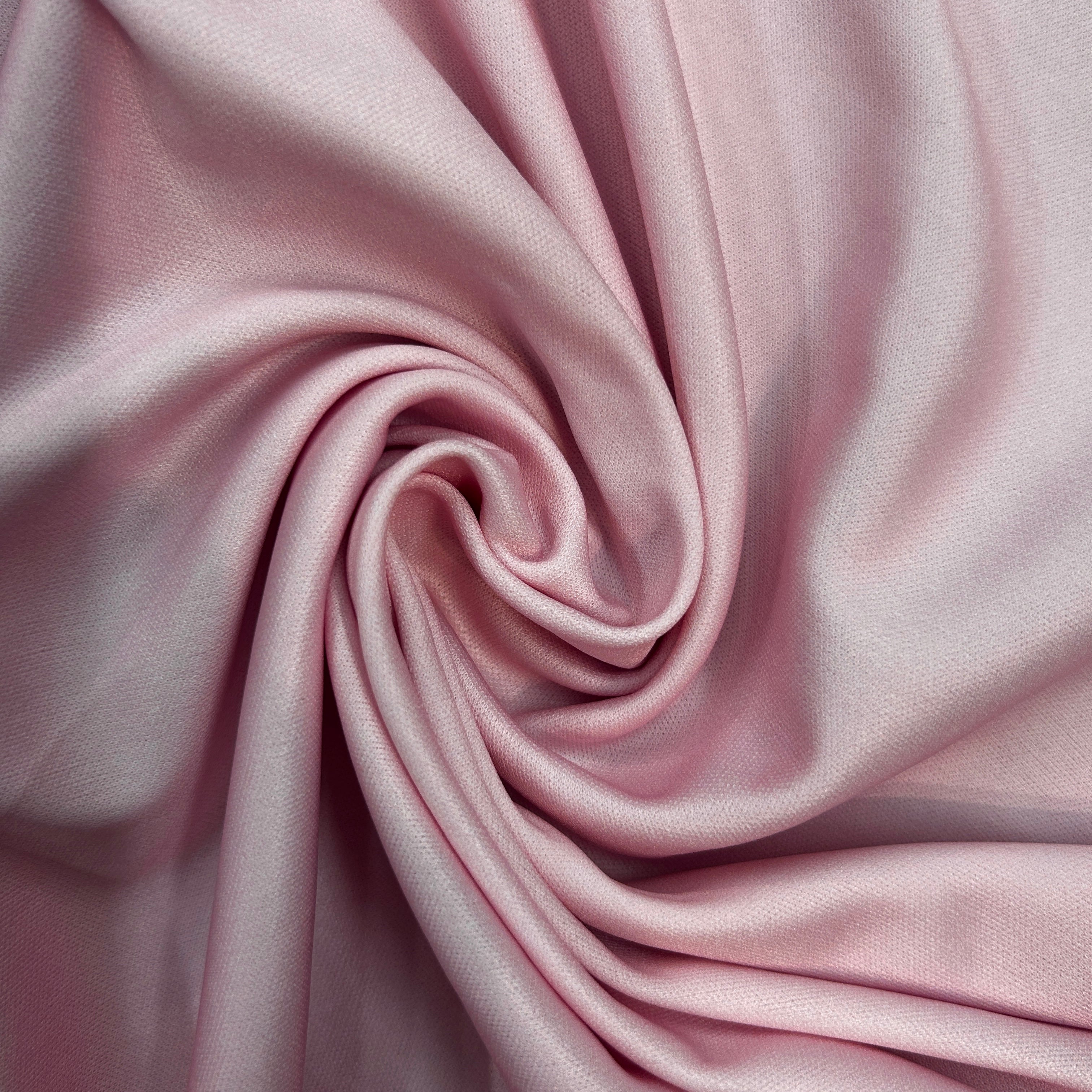 Close-up of pink fabric with folds