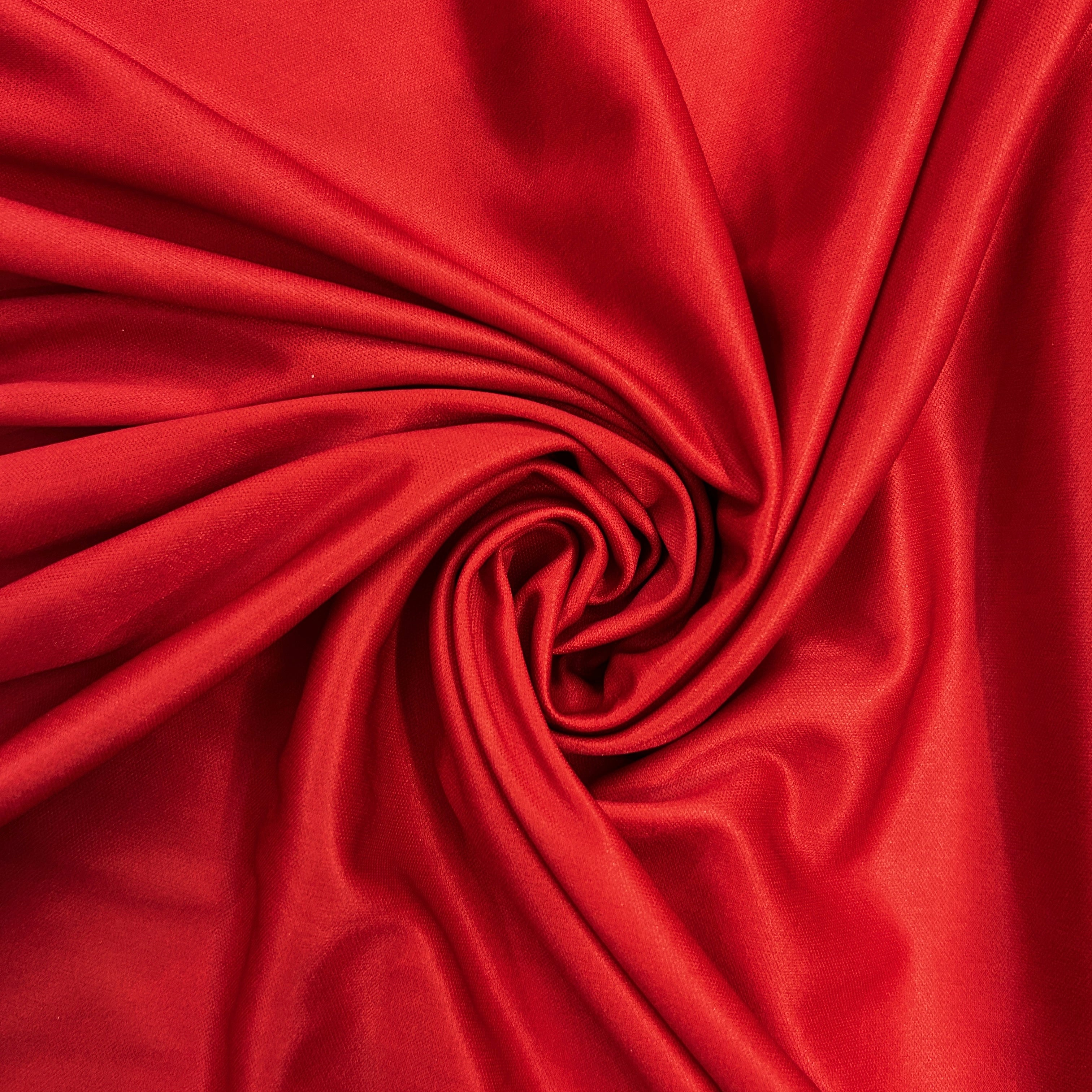 Close-up of red fabric with a swirl pattern