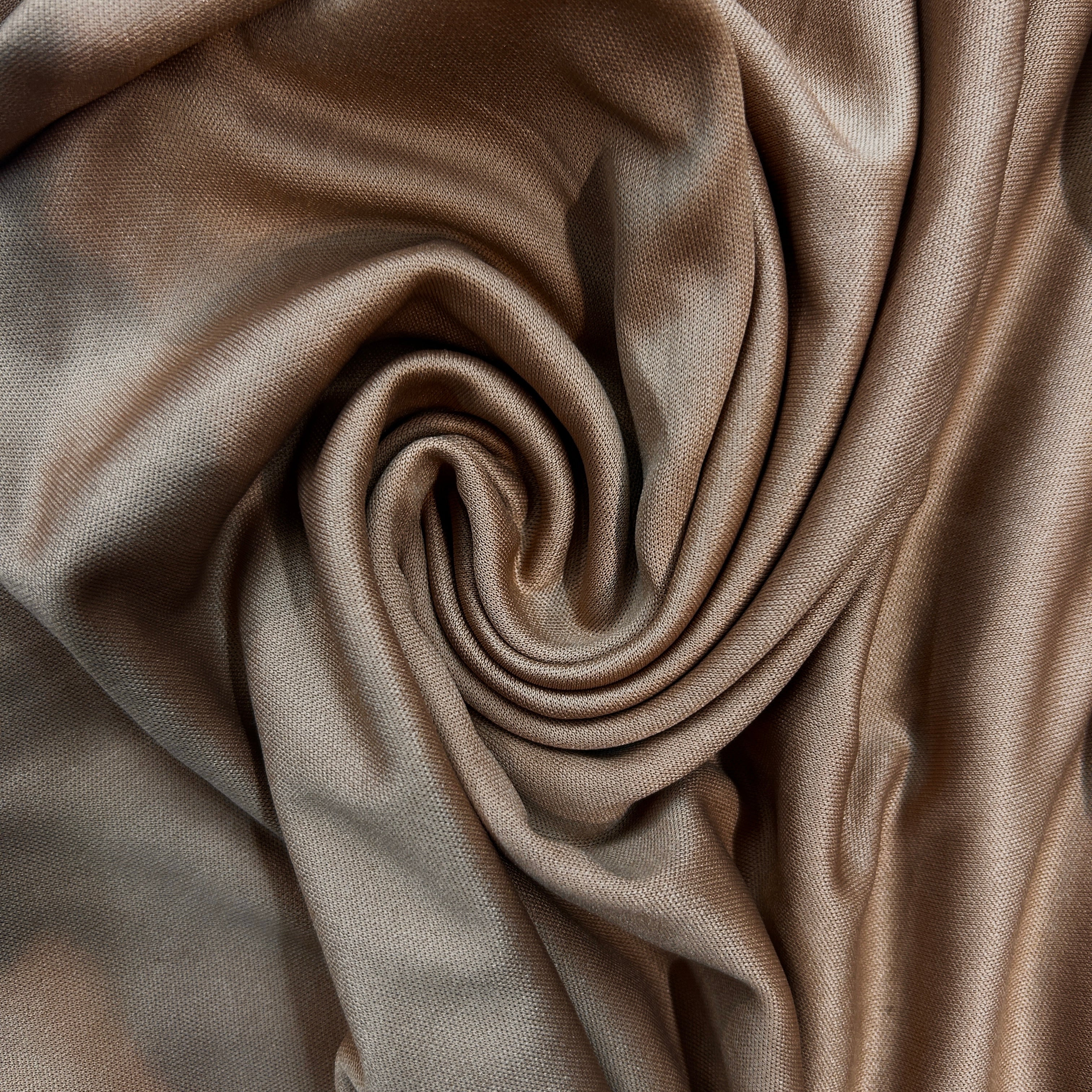 Close-up of beige fabric with folds