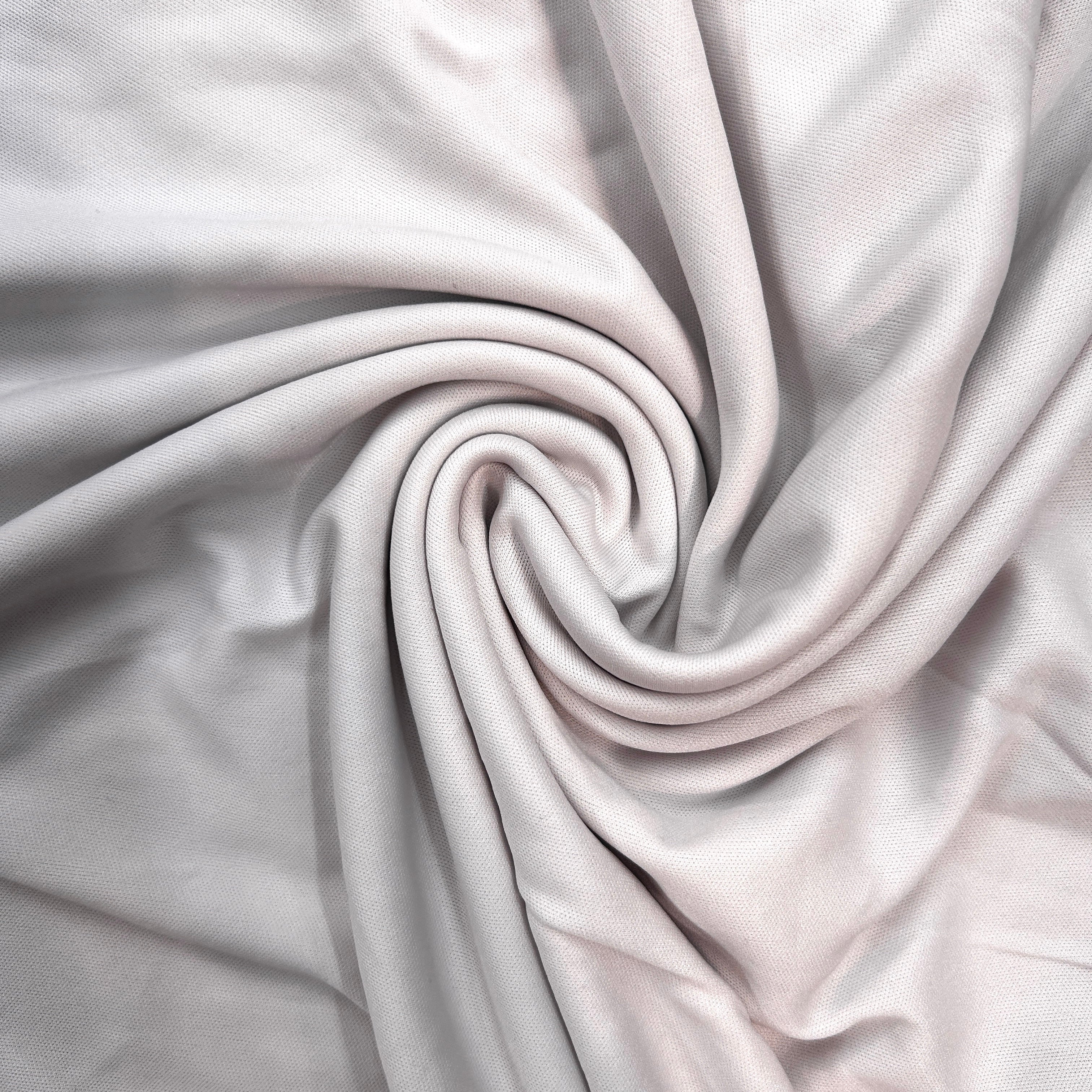Close-up of gray fabric with a swirl pattern