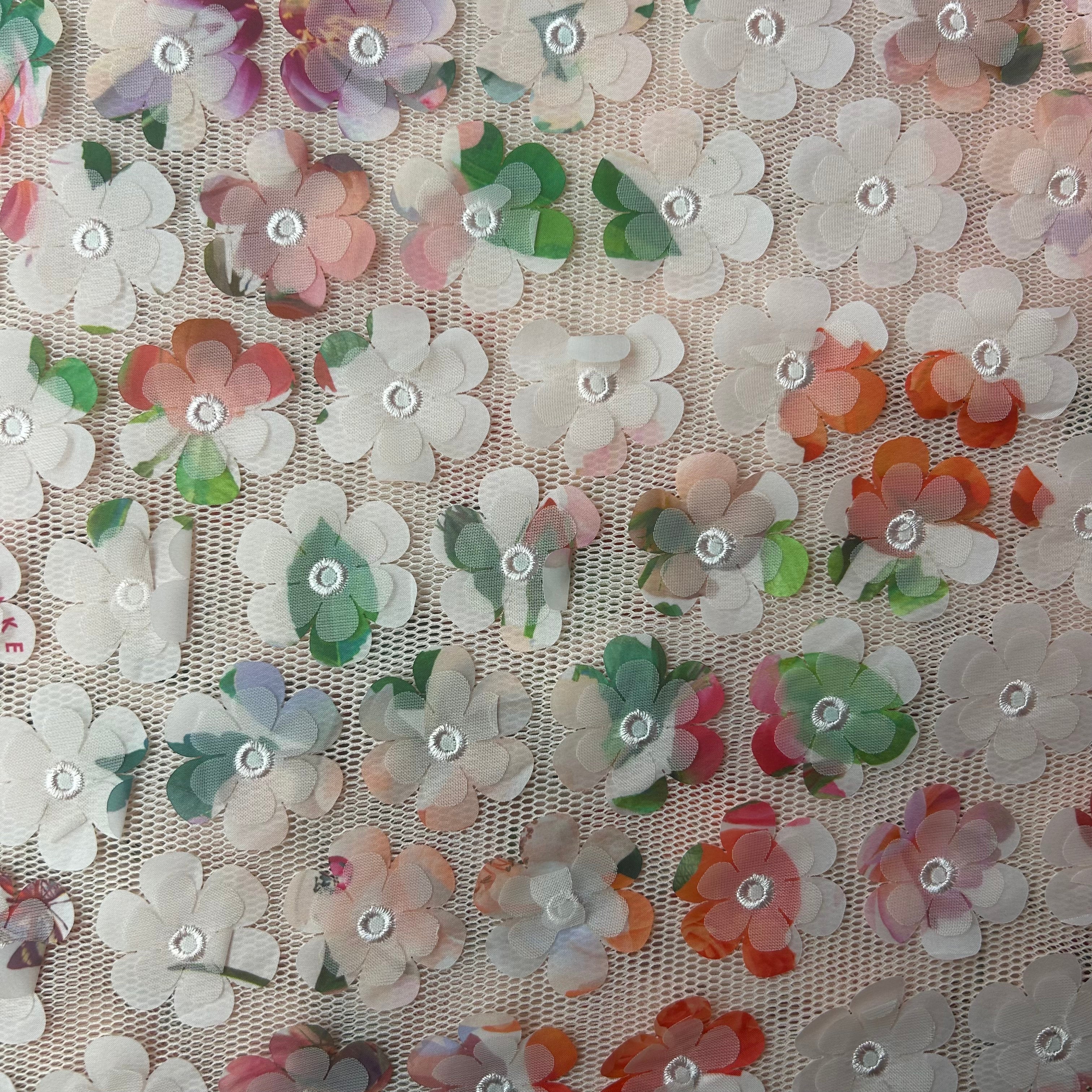 Close-up of floral fabric with multicolored flowers on a beige background