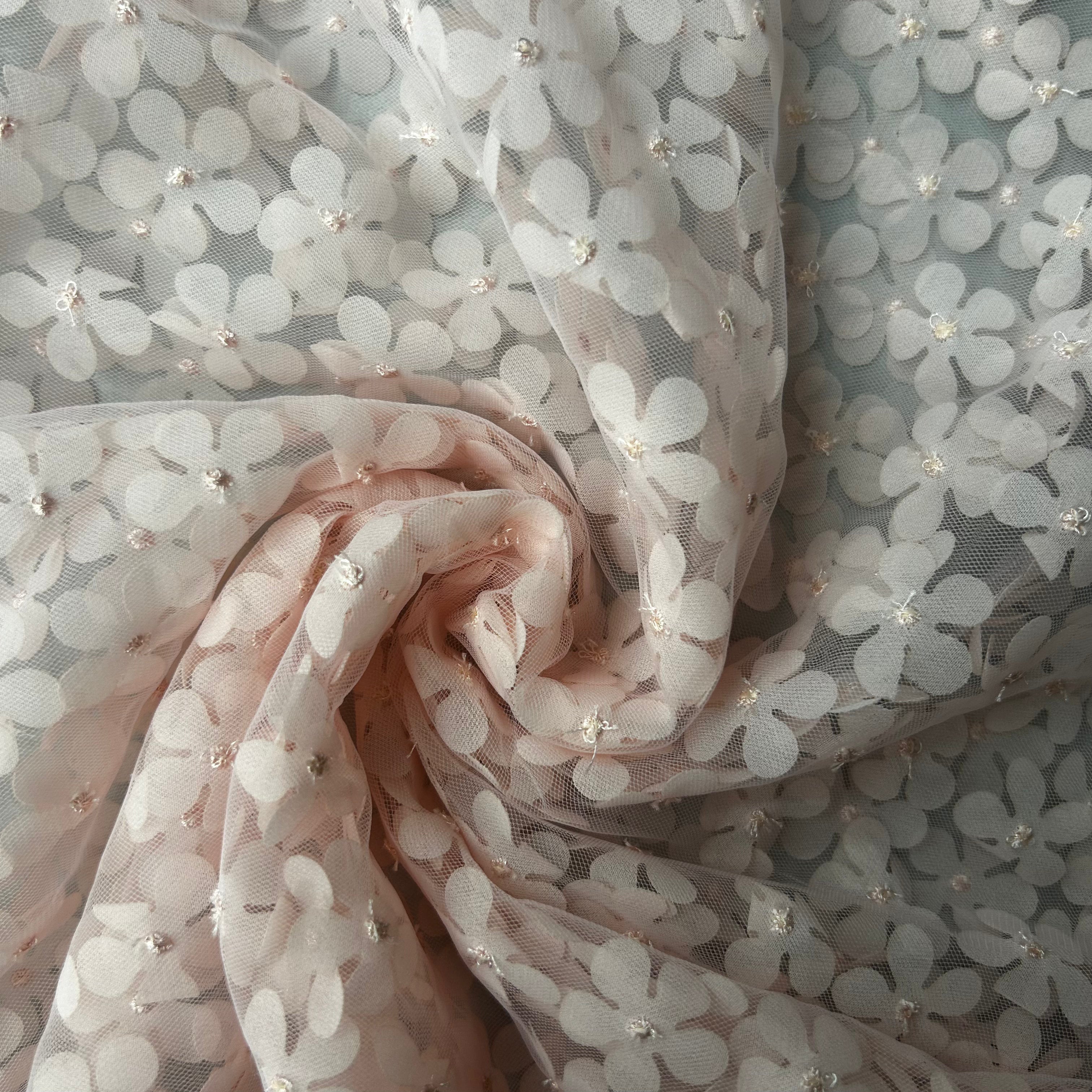 Sheer fabric with floral pattern and small embellishments
