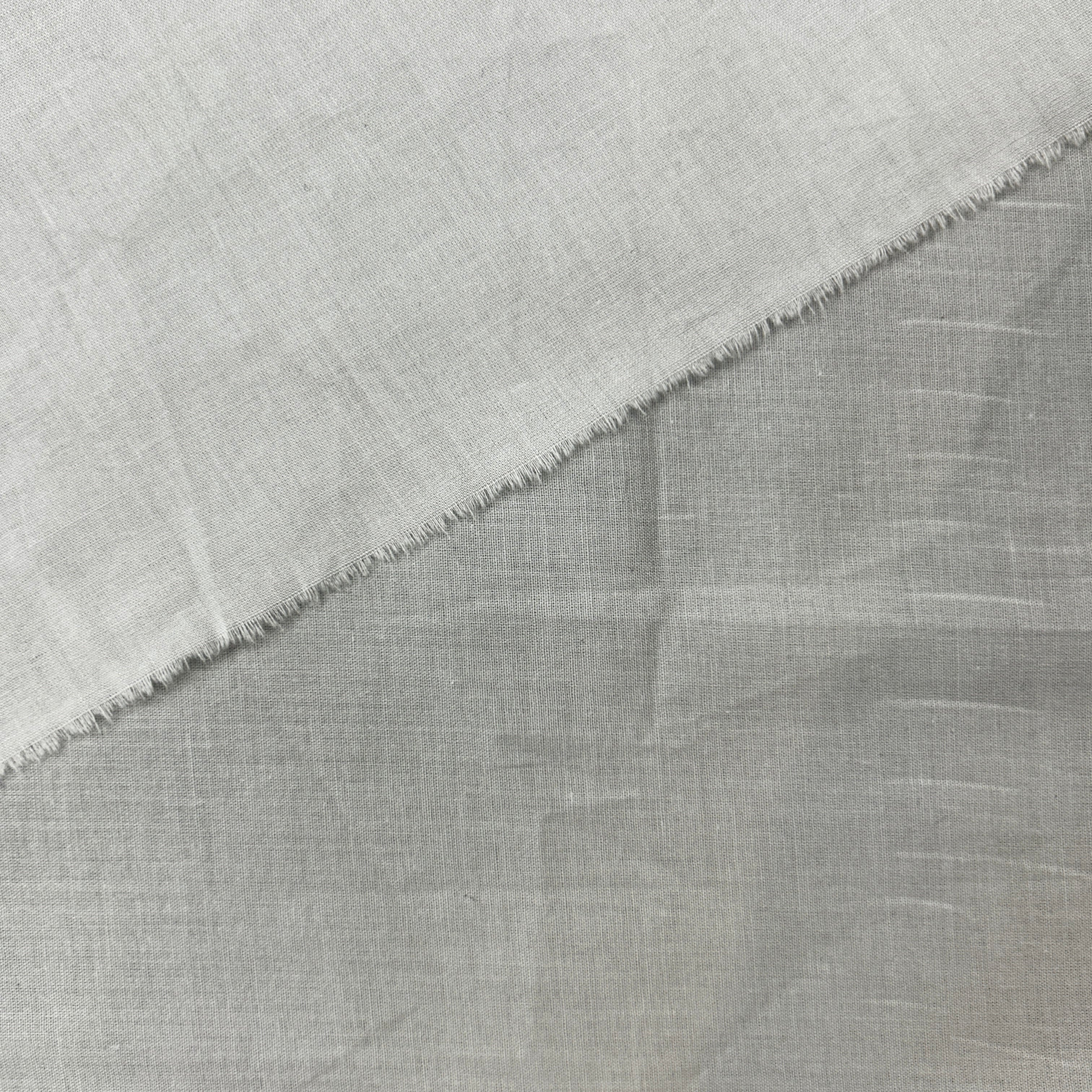 Close-up of gray fabric with a subtle pattern