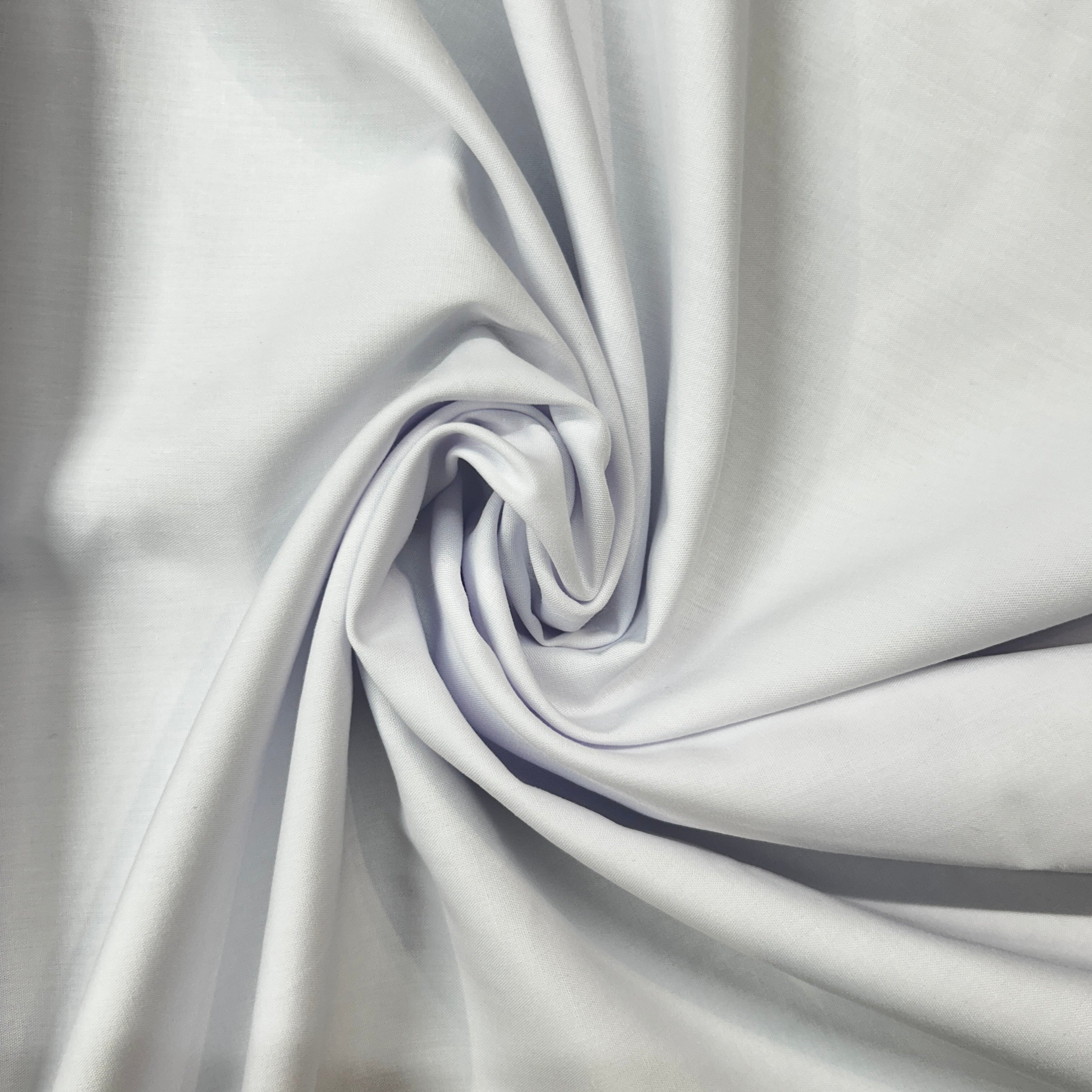 Close-up of white fabric with folds