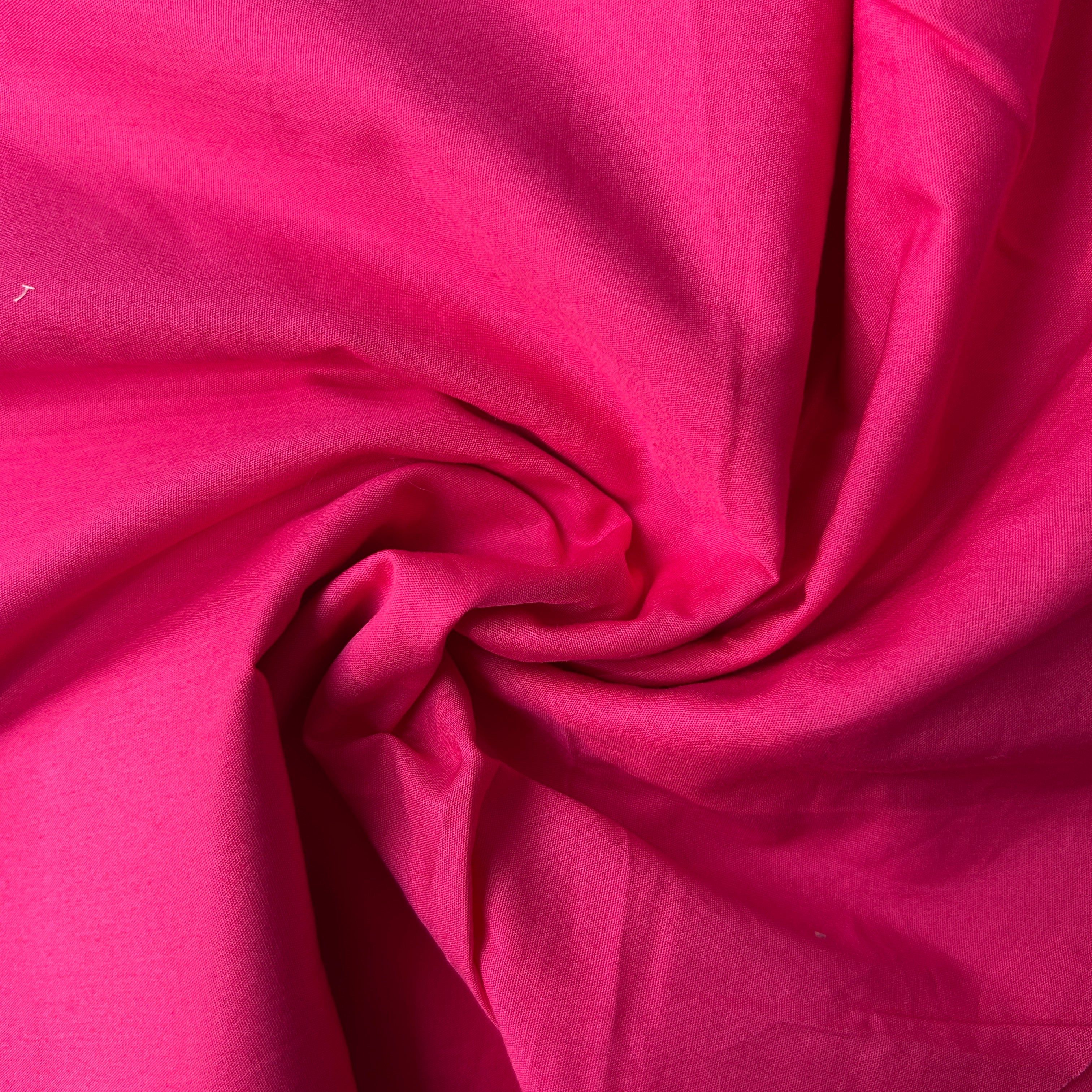 Close-up of pink fabric with folds
