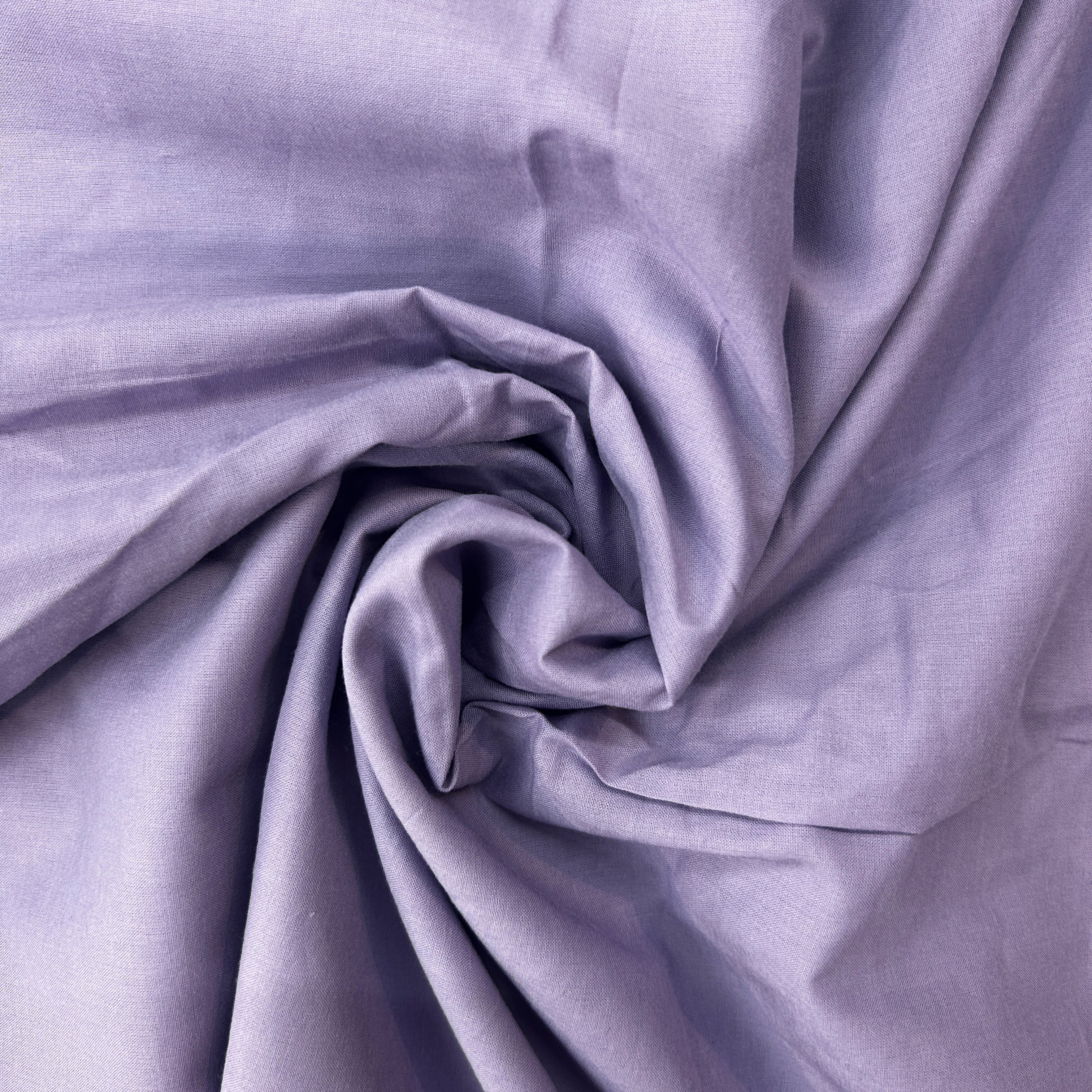 Close-up of purple fabric with folds