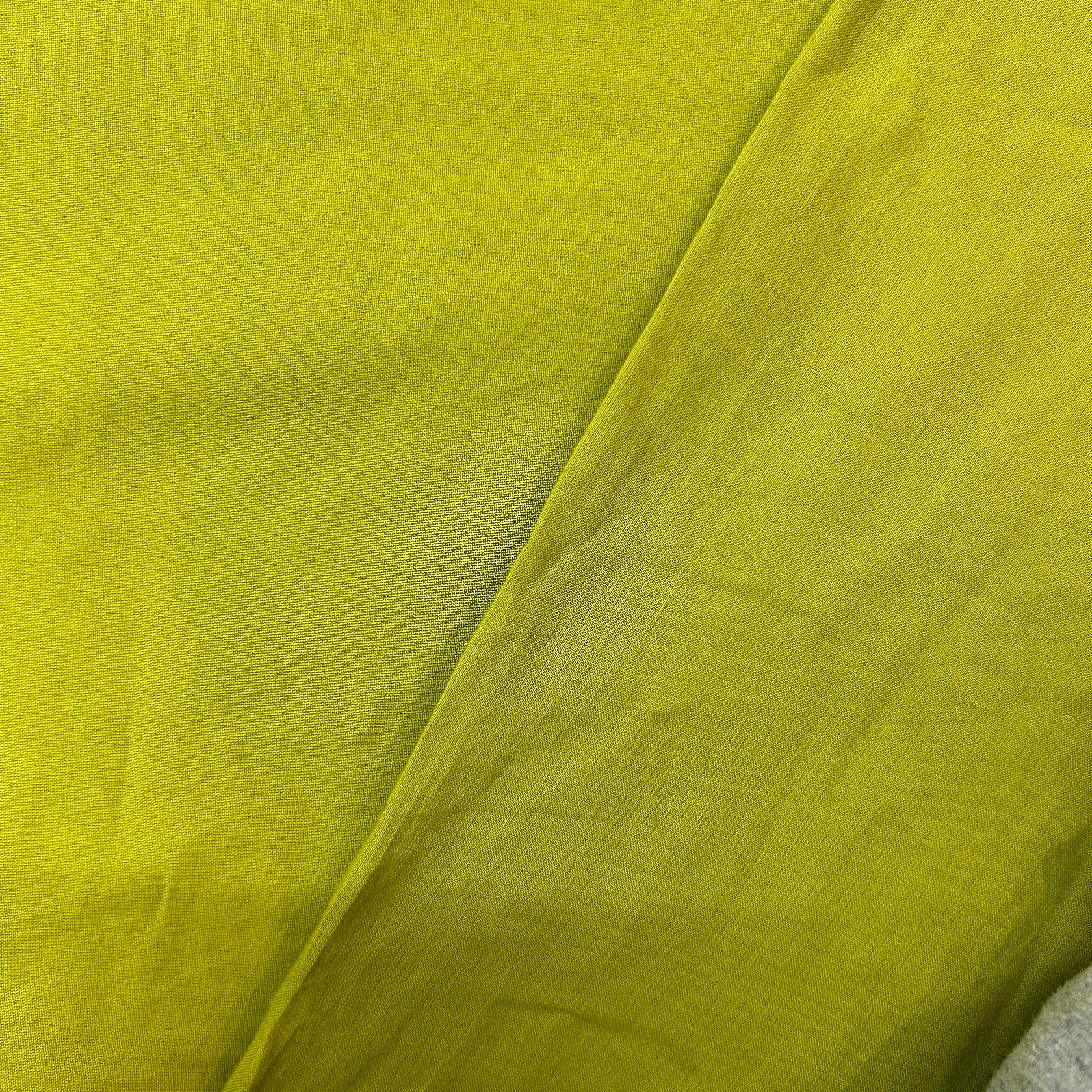 Close-up of green fabric with a slight texture