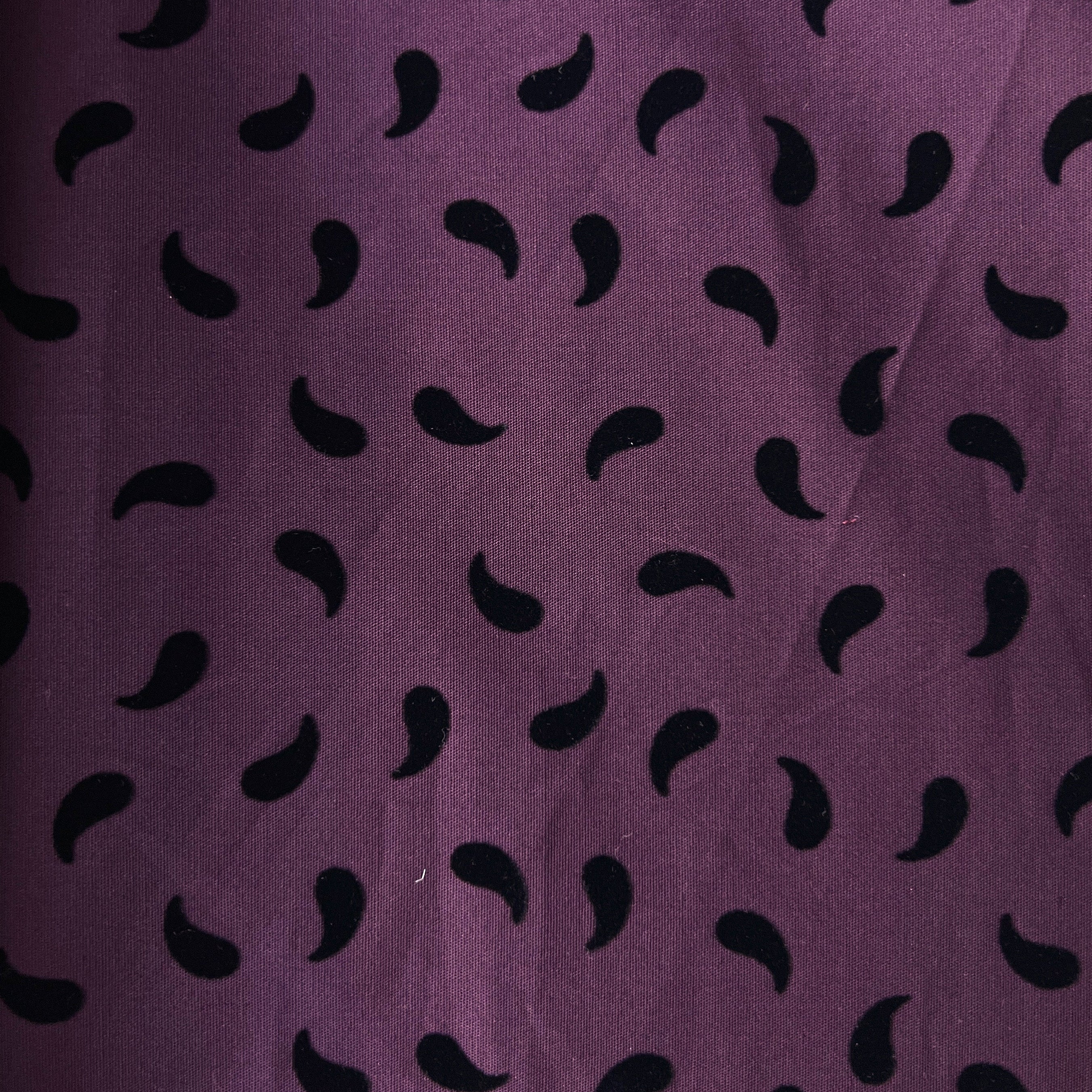 Purple fabric with black leaf pattern