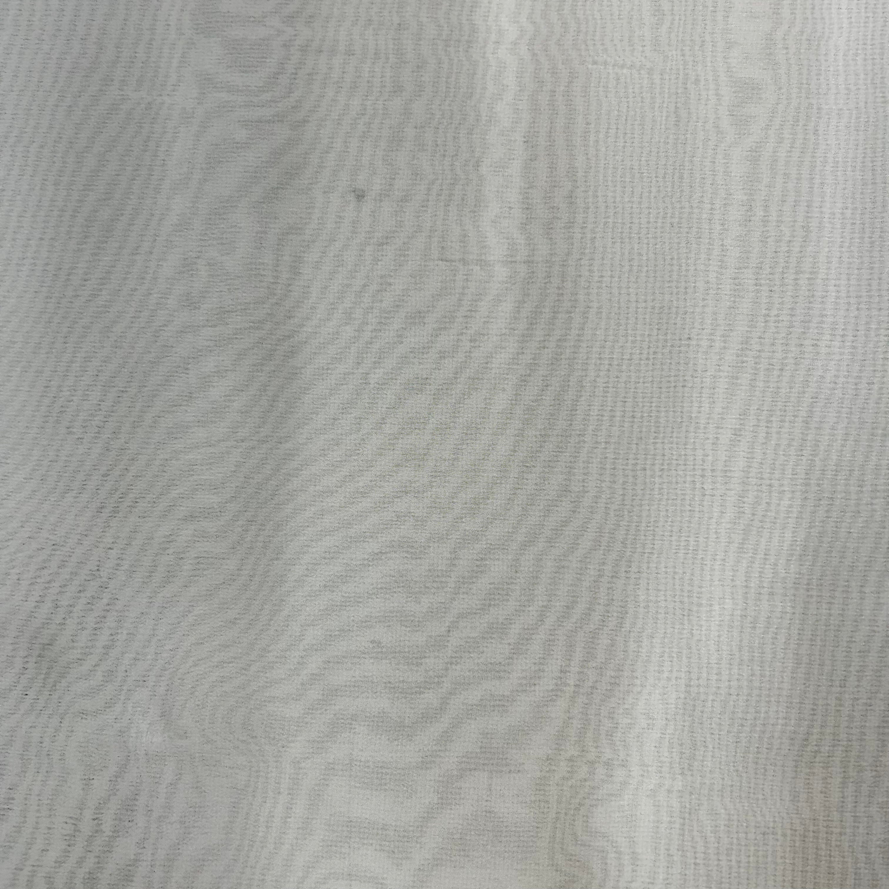 Close-up of textured white fabric