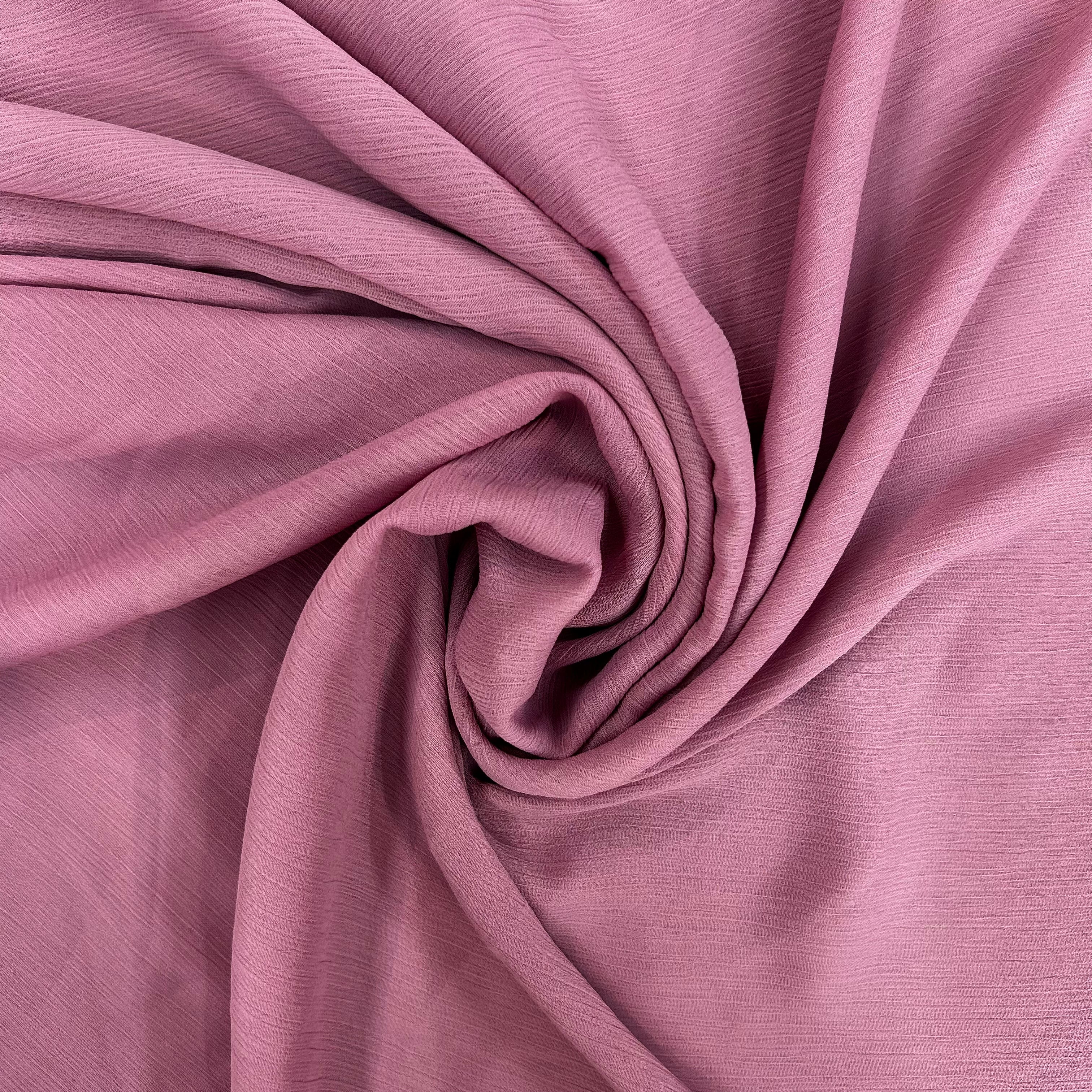 Close-up of pink fabric with folds