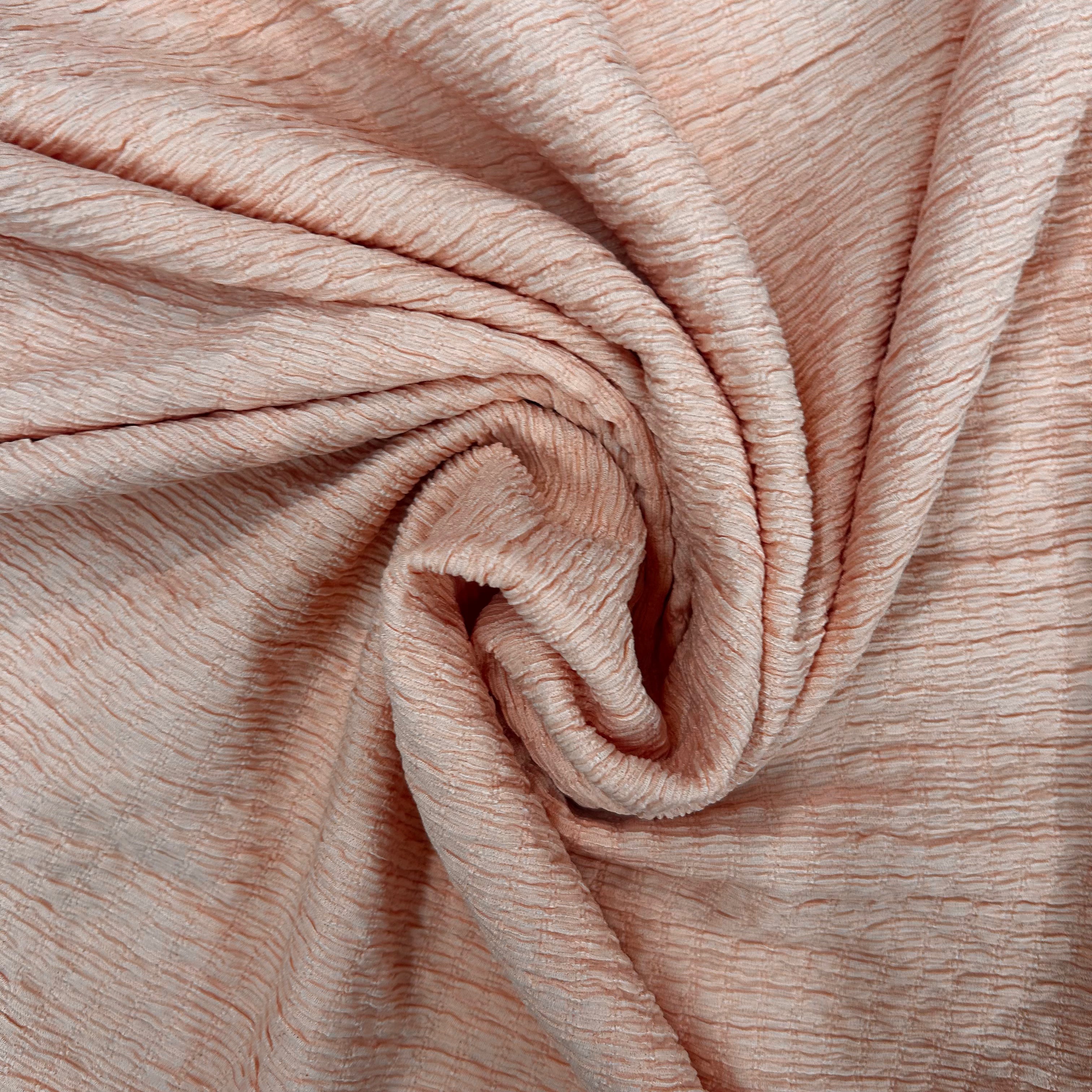 Close-up of beige fabric with a textured pattern