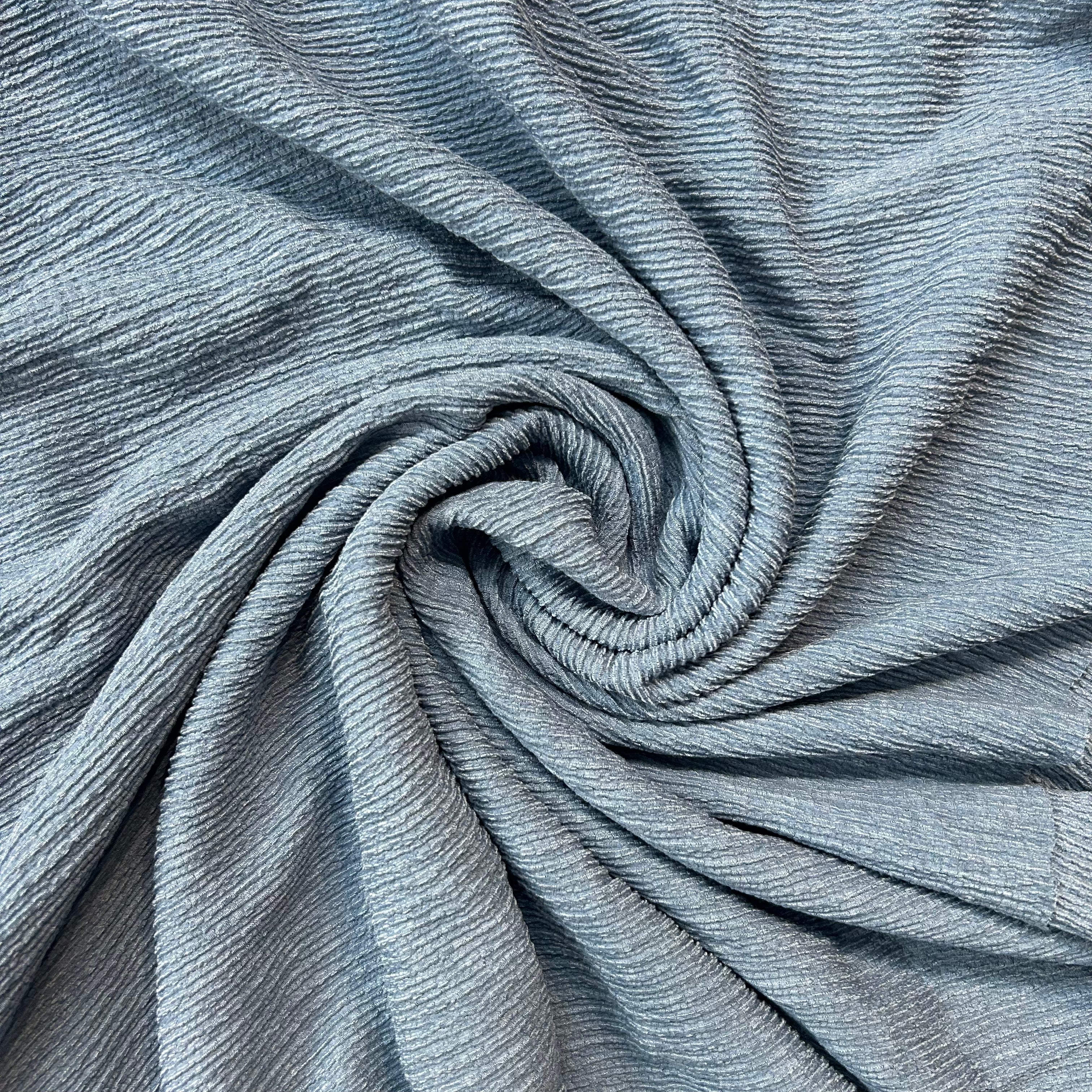 Close-up of blue fabric with a swirl pattern