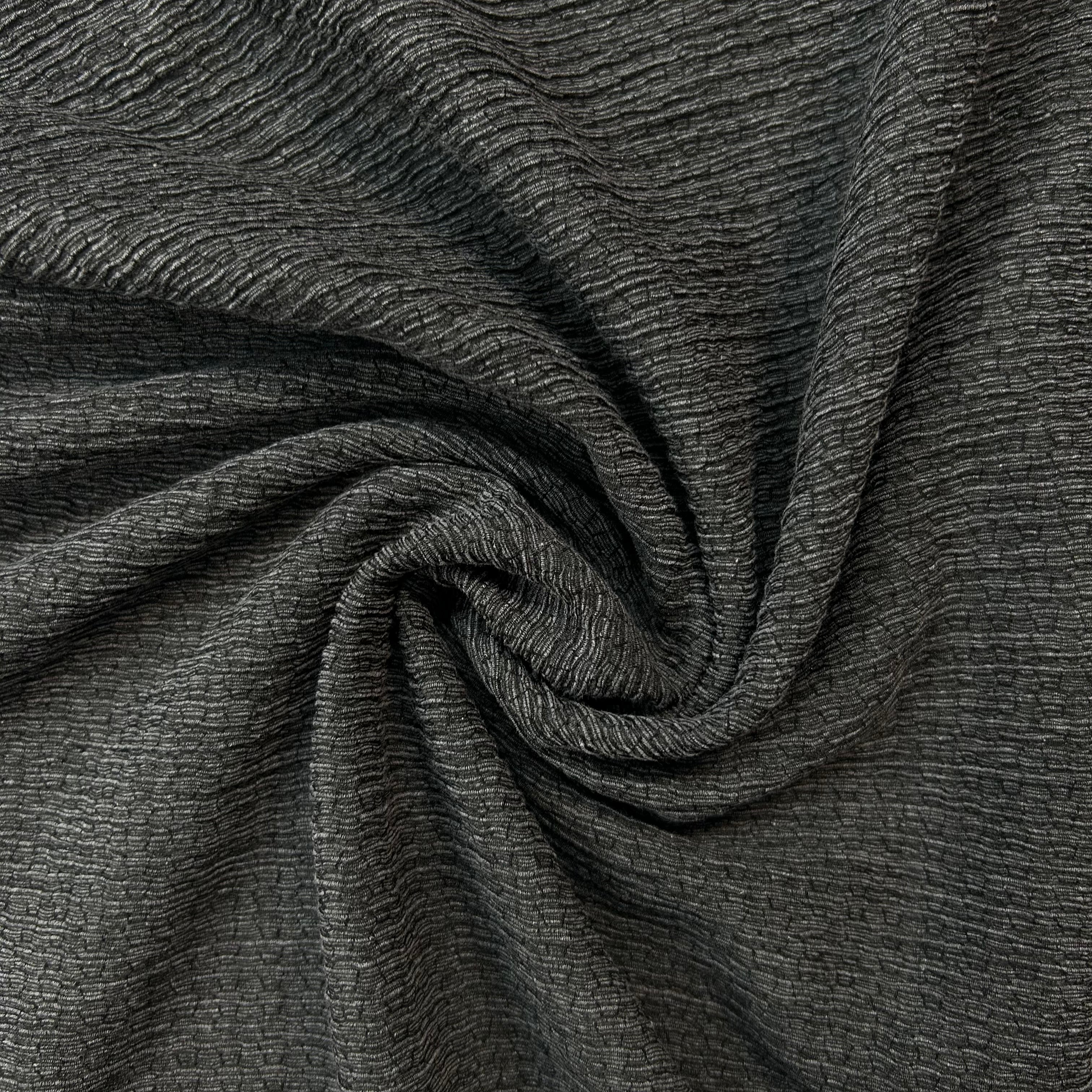 Close-up of dark gray textured fabric