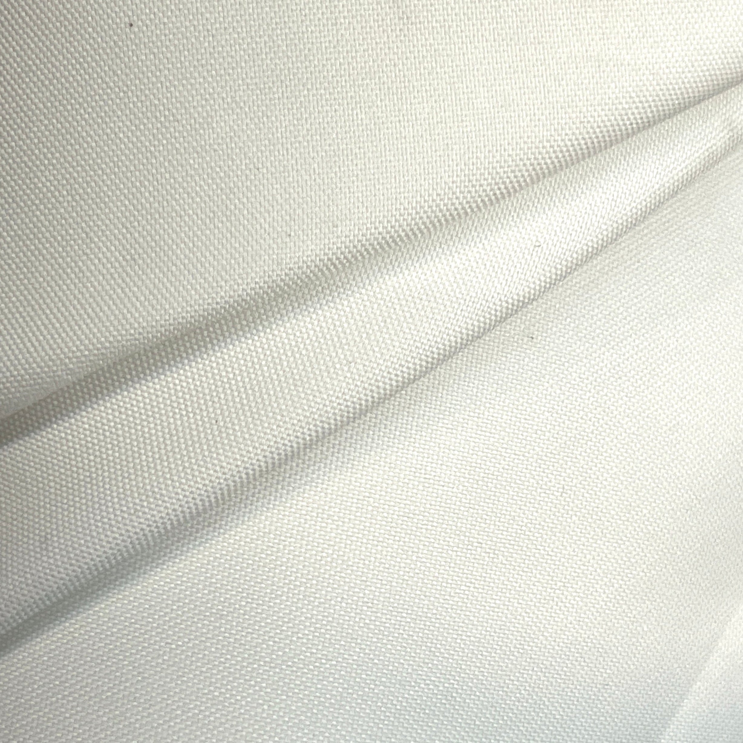 Close-up of white fabric with a subtle pattern