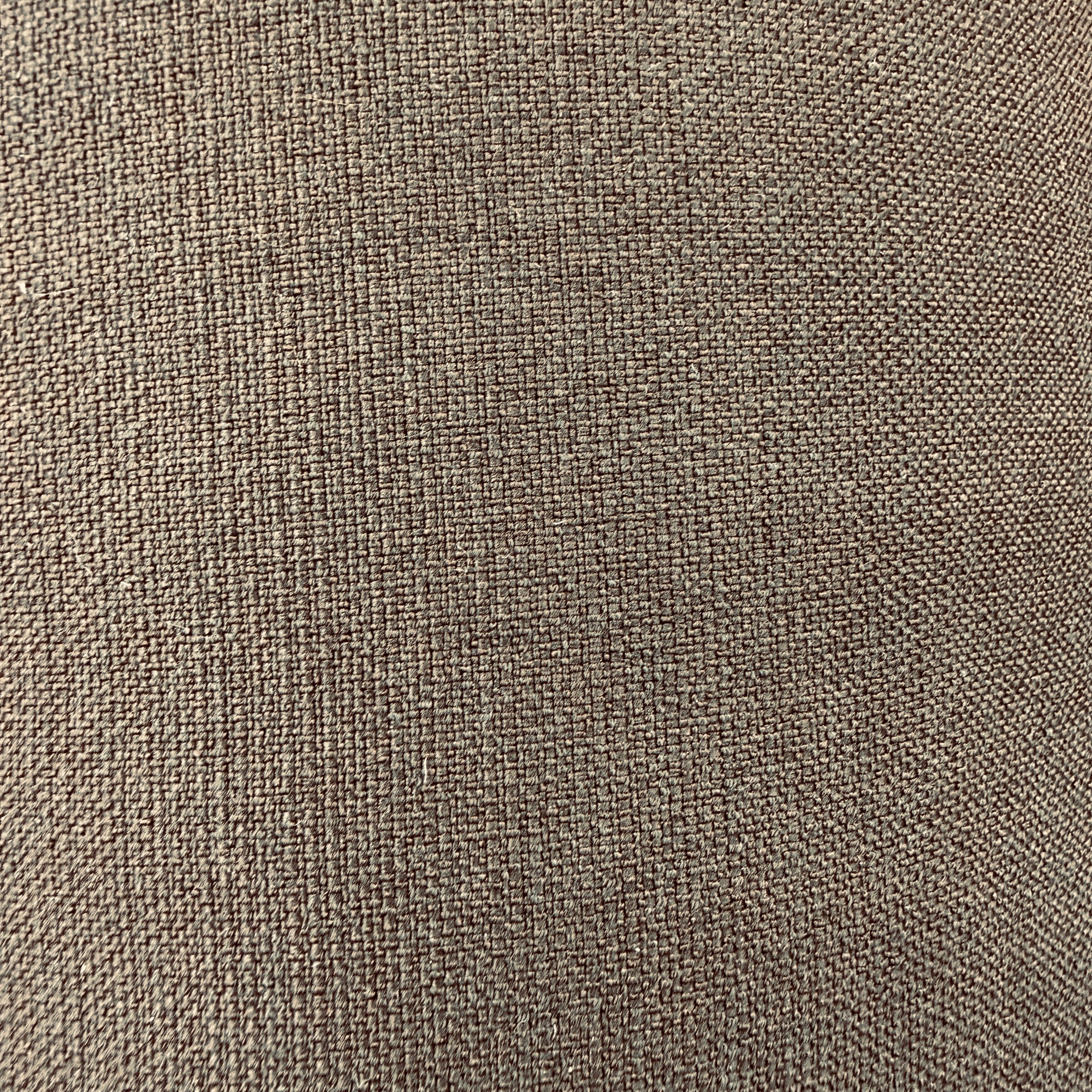 A close-up of woven fabric texture in a warm taupe-brown color, filling the entire frame.