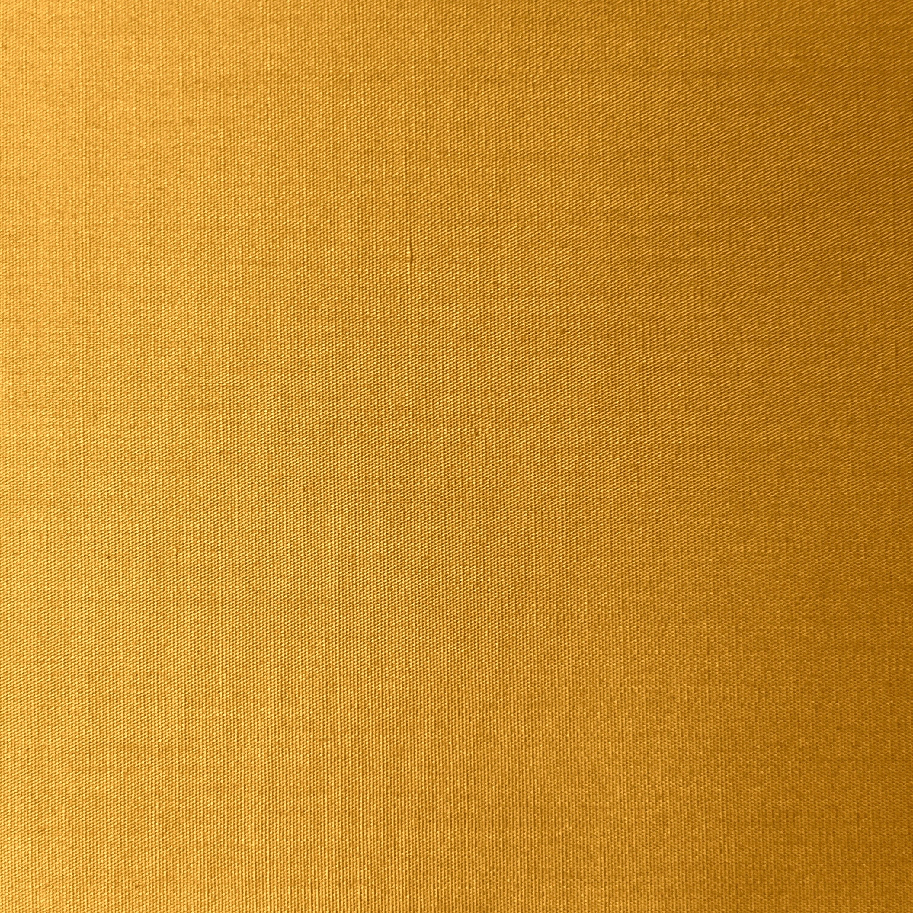 100% cotton poplin fabric in a plain weave, shown in a golden yellow color.